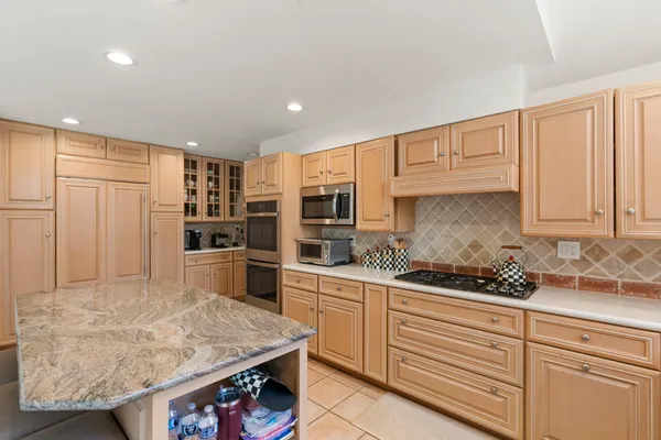a view of a room with wooden floor and windows