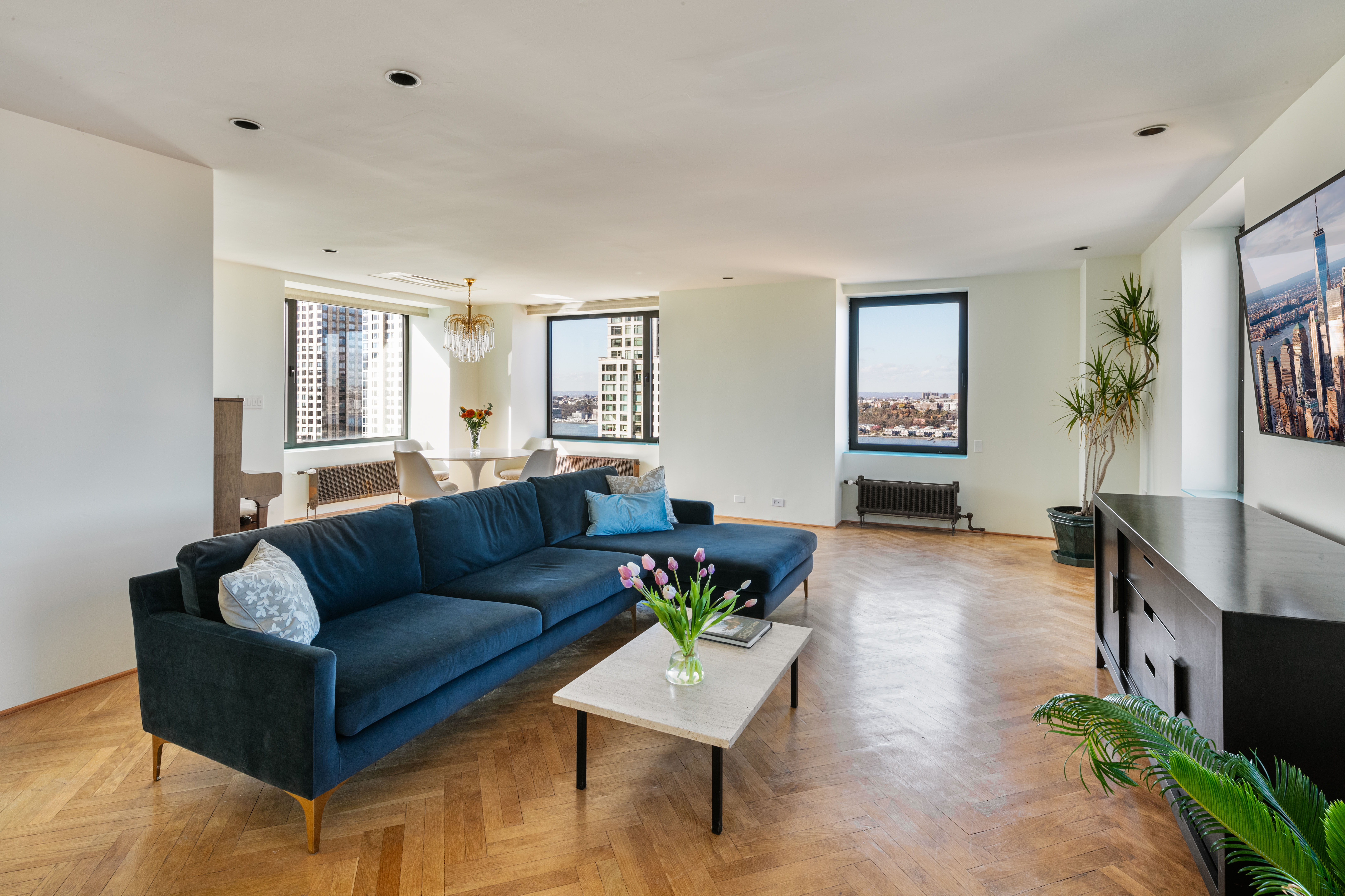 263 West End Avenue, Unit PH22B Manhattan, NY 10023 - Photo 2 of 19 a living room with furniture and a wooden floor