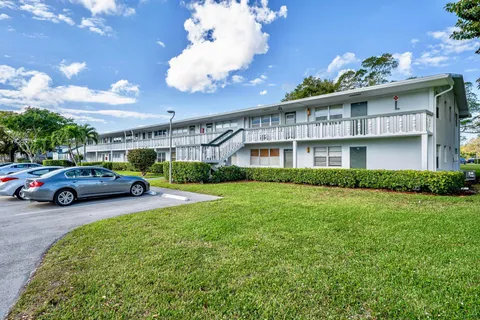 a view of a car parked in front of a building