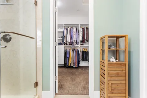 a bedroom with a bed and a cabinets