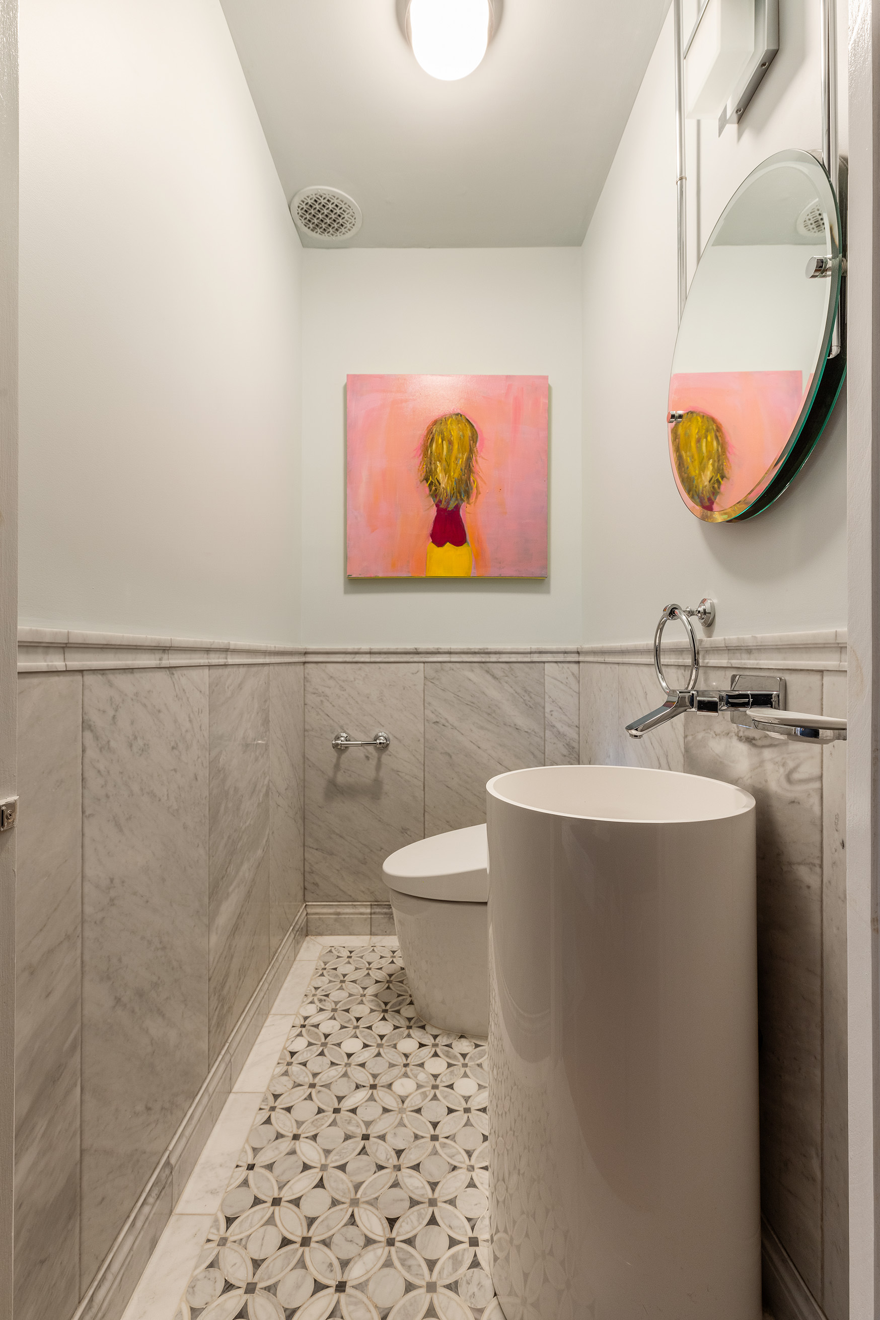 6 East 76th Street, Unit 3F Manhattan, NY 10021 - Photo 9 of 11 a bathroom with a sink a toilet and mirror