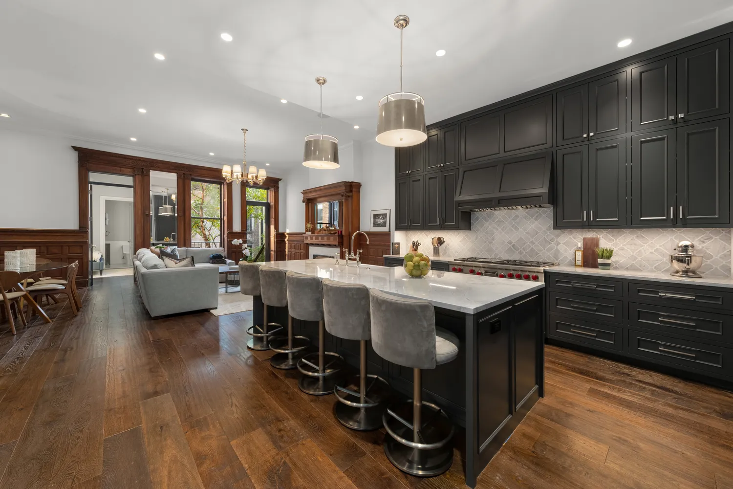 a kitchen with a stove a sink and a refrigerator