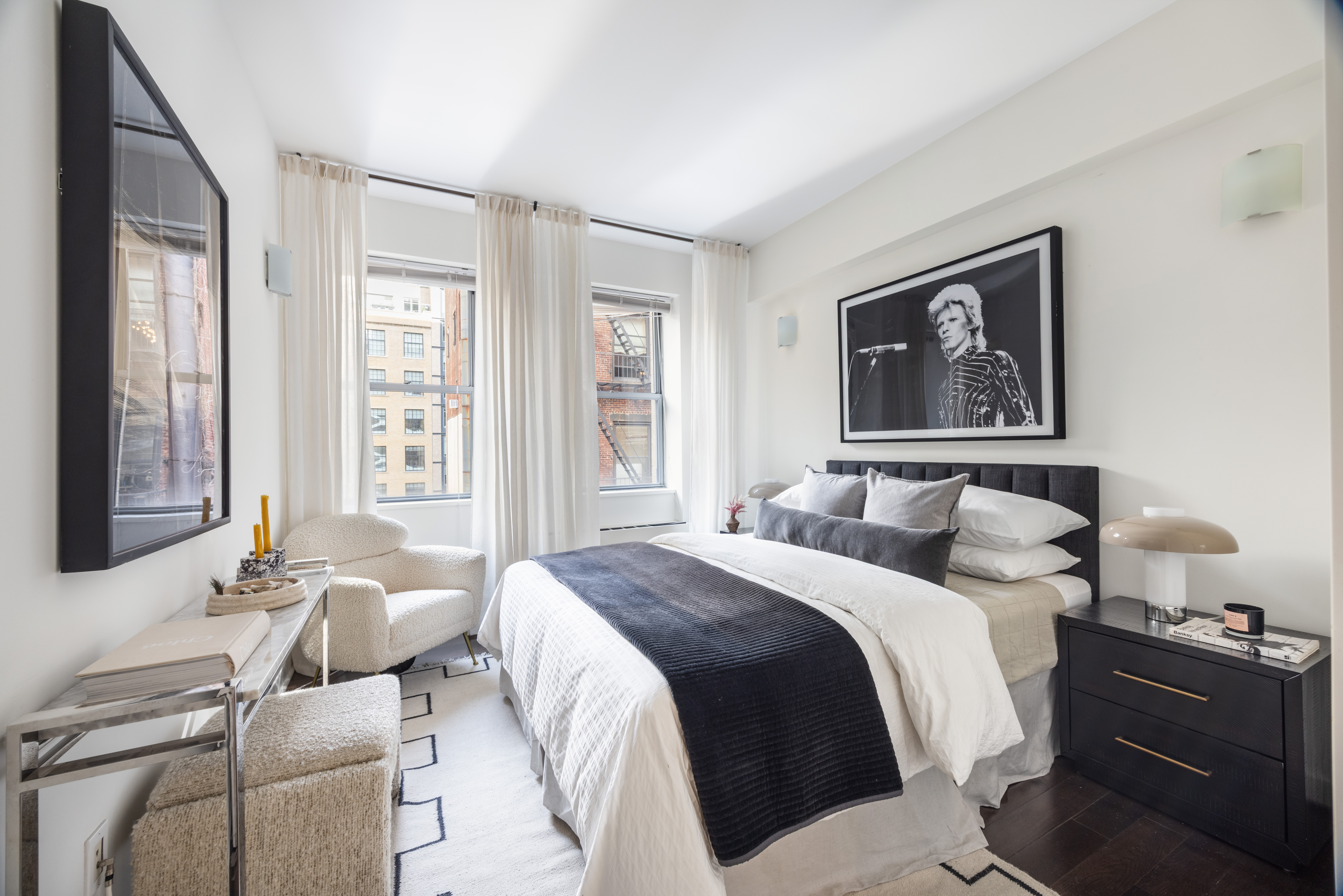 27 West 19th Street, Unit 6 Manhattan, NY 10011 - Photo 8 of 10 a bedroom with a bed and wooden floor