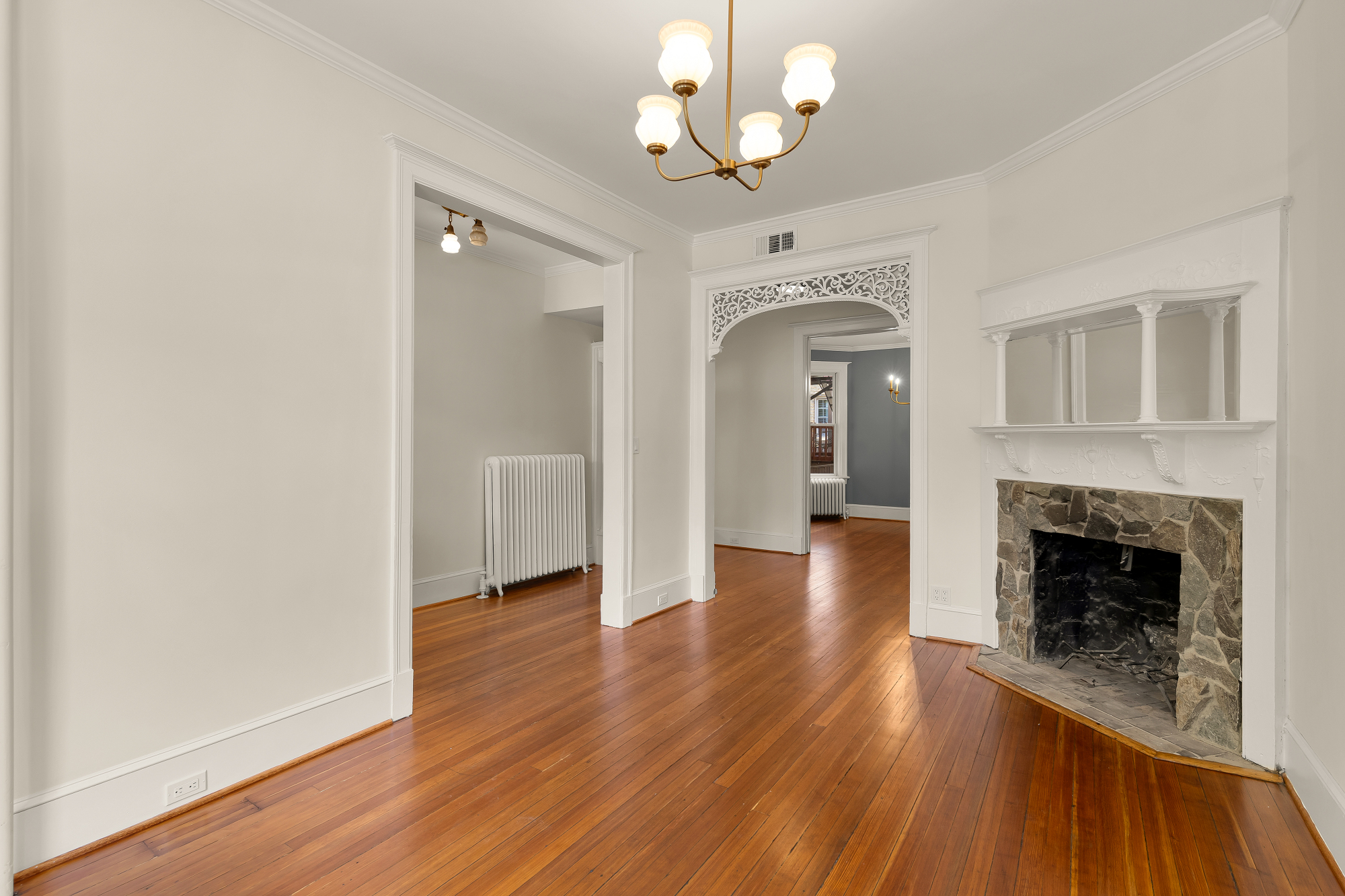 1737 Park Road Northwest Washington, DC 20010 - Photo 3 of 32 wooden floor fireplace and windows in an empty room