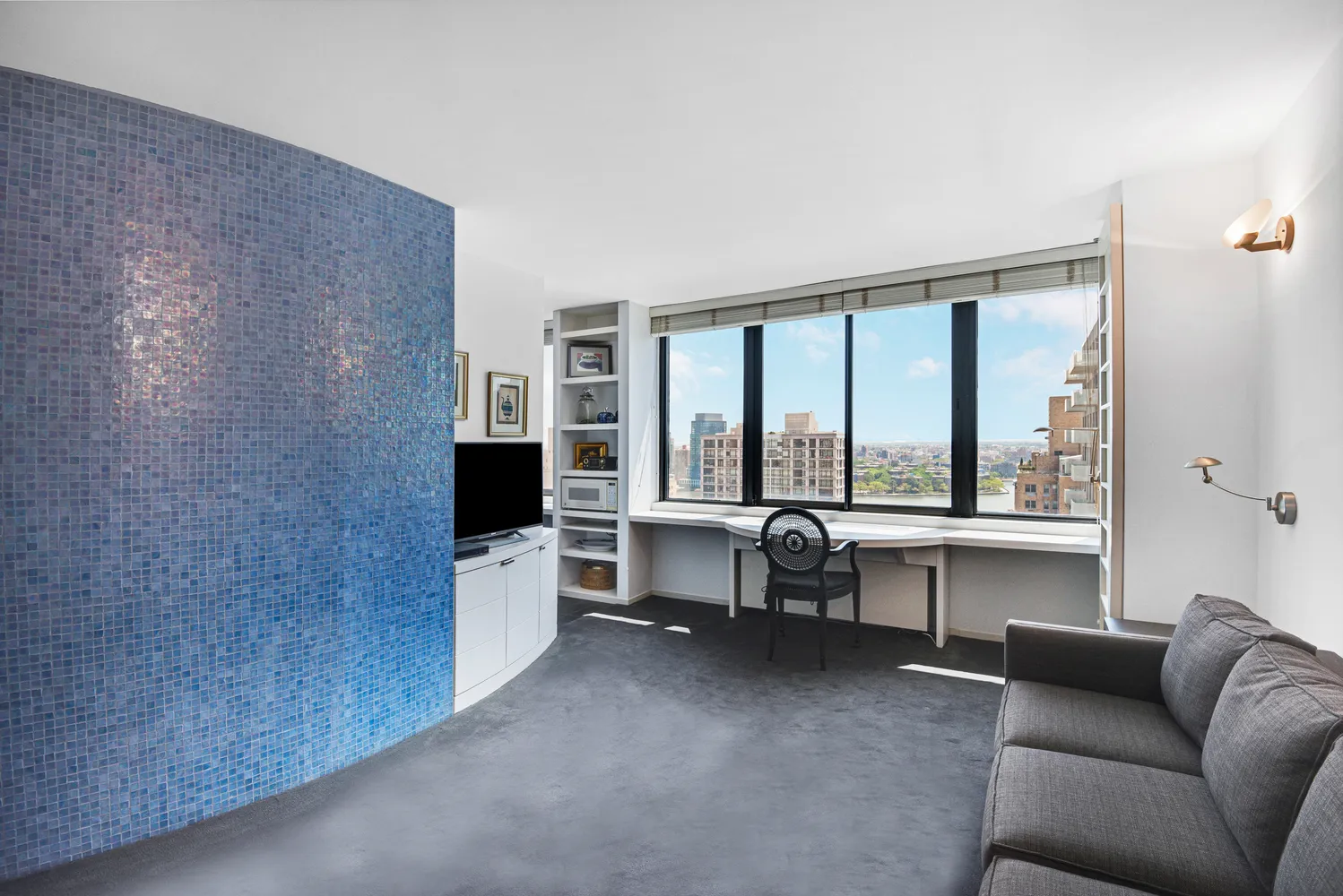 a living room with furniture and windows