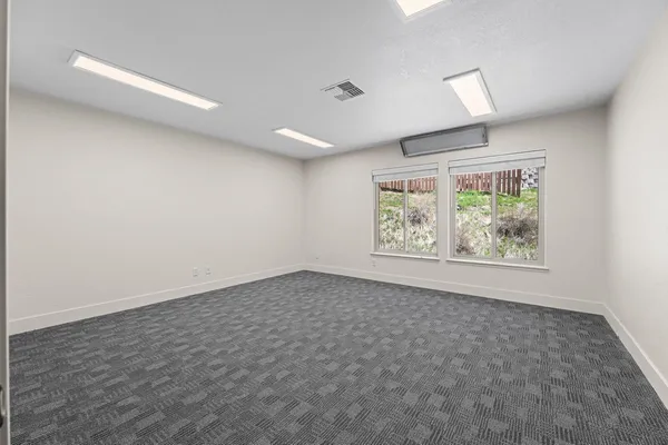 an empty room with windows