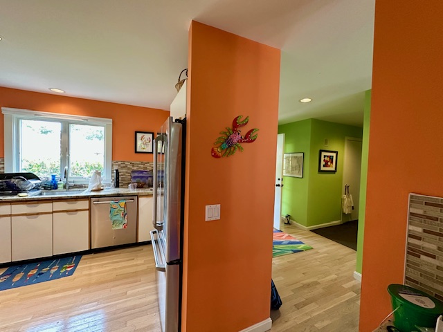 11 Juniper Circle Brewster, MA 02631 - Photo 7 of 29 a view of a hallway with wooden floor and furniture
