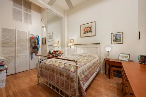 a bed room with a bed and a table in it