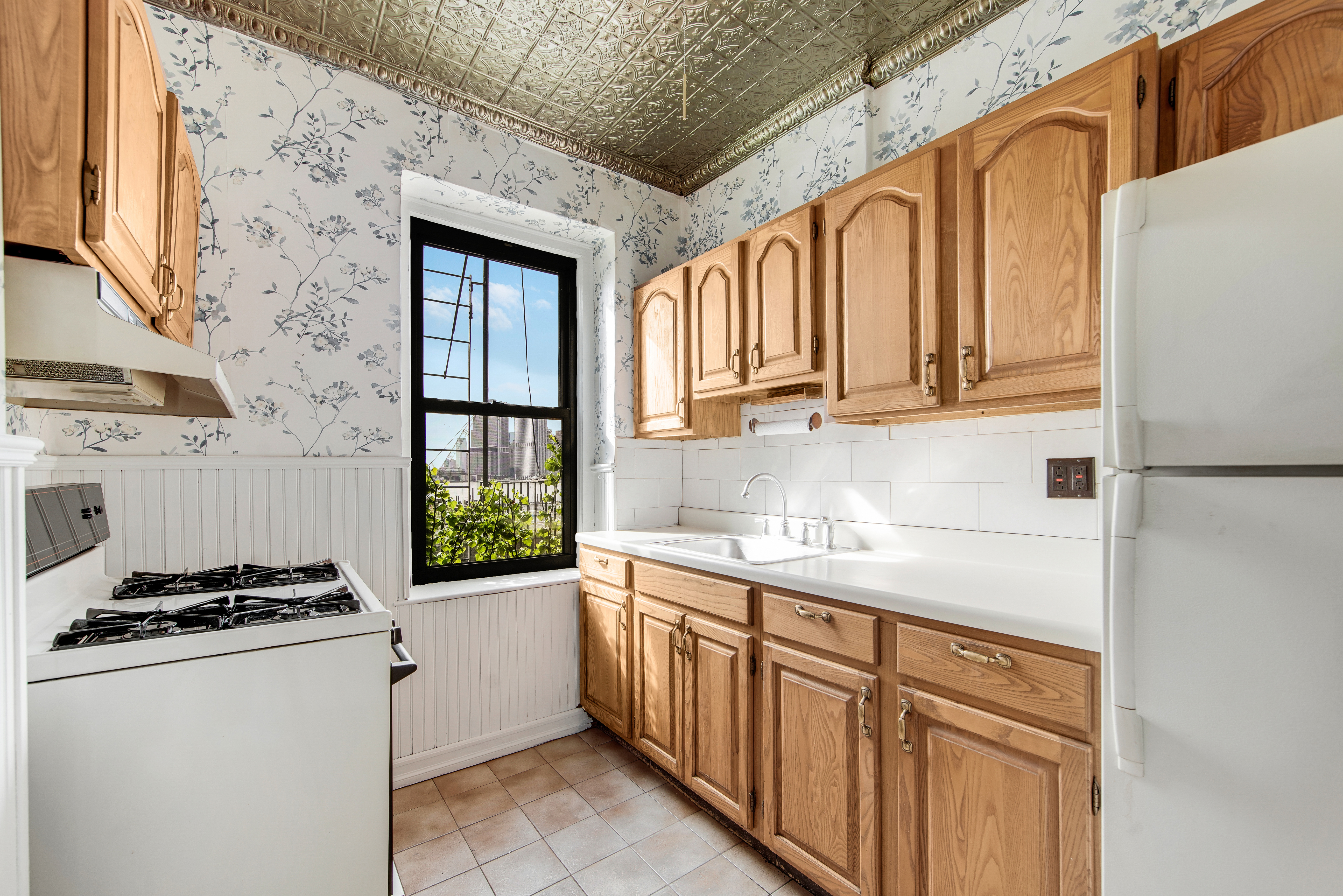 2 Grace Court, Unit 1X Brooklyn, NY 11201 - Photo 4 of 12 a kitchen with stainless steel appliances granite countertop a stove a sink and a refrigerator