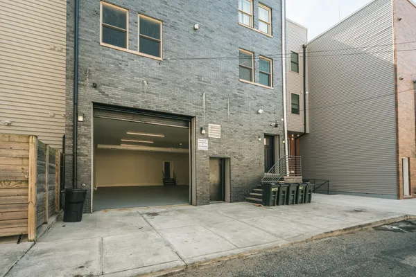 a front view of a house with barbeque