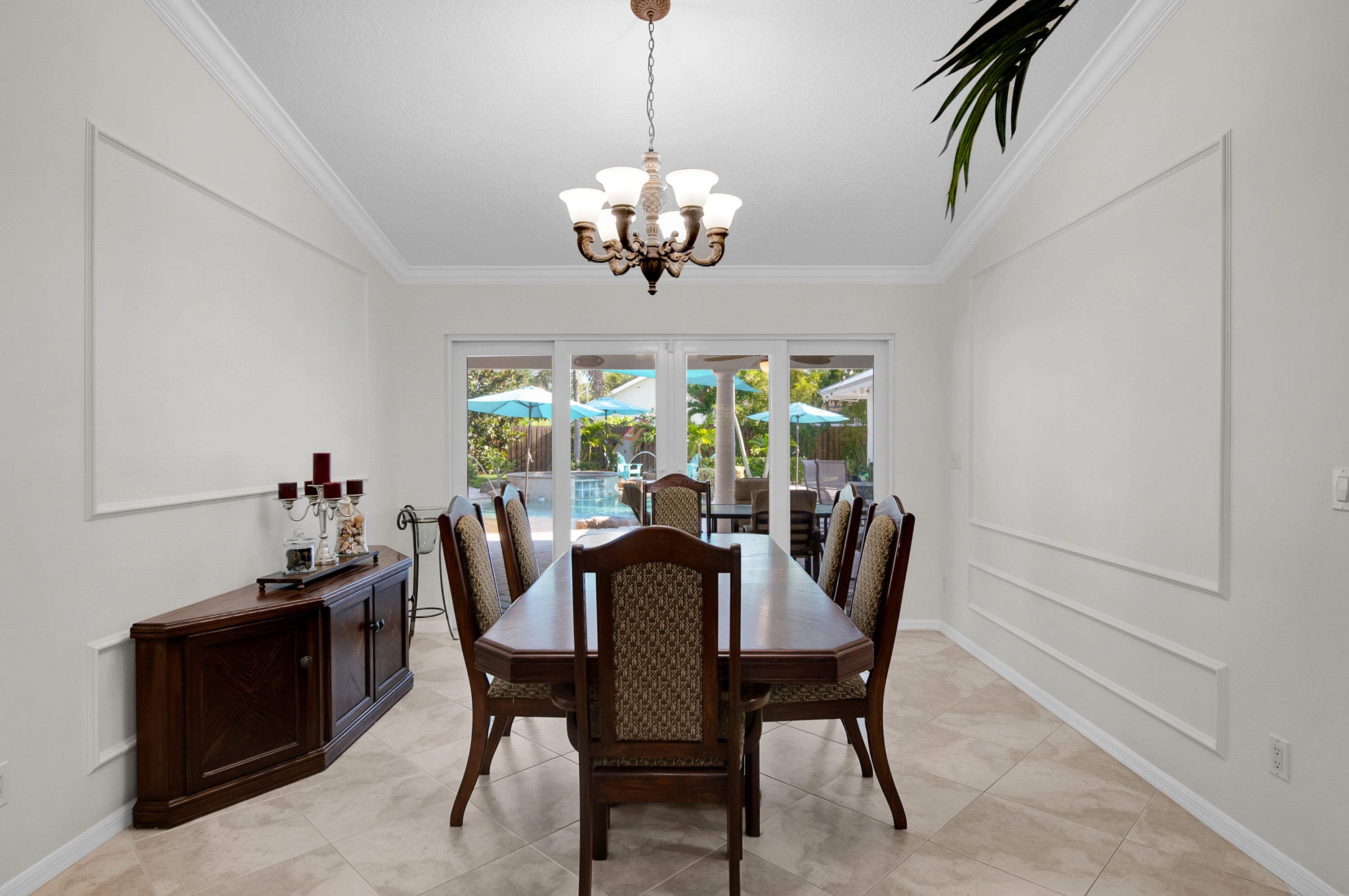1560 Southwest 16th Street Boca Raton, FL 33486 - Photo 45 of 72 a view of a dining room with furniture a chandelier and window