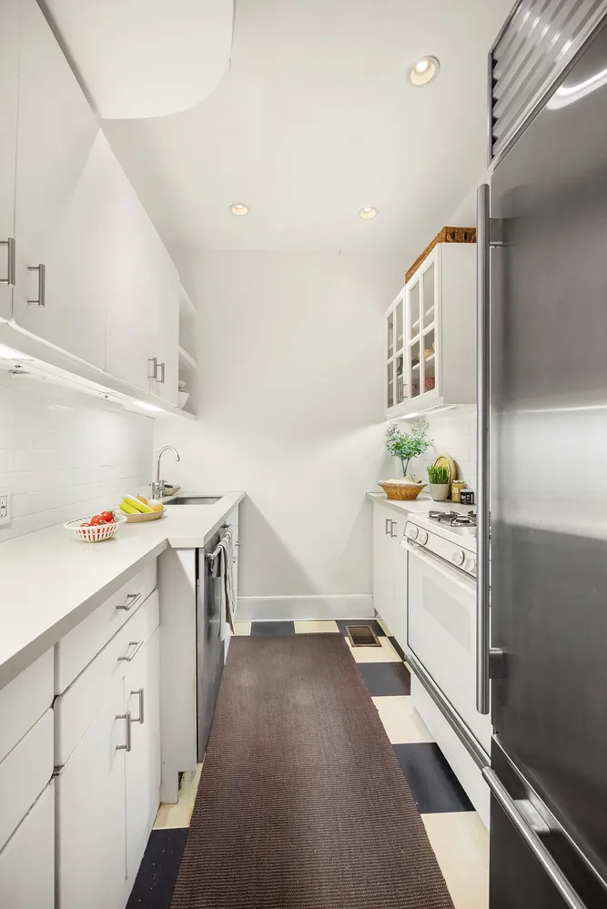 a bathroom with a sink a toilet and shower curtain