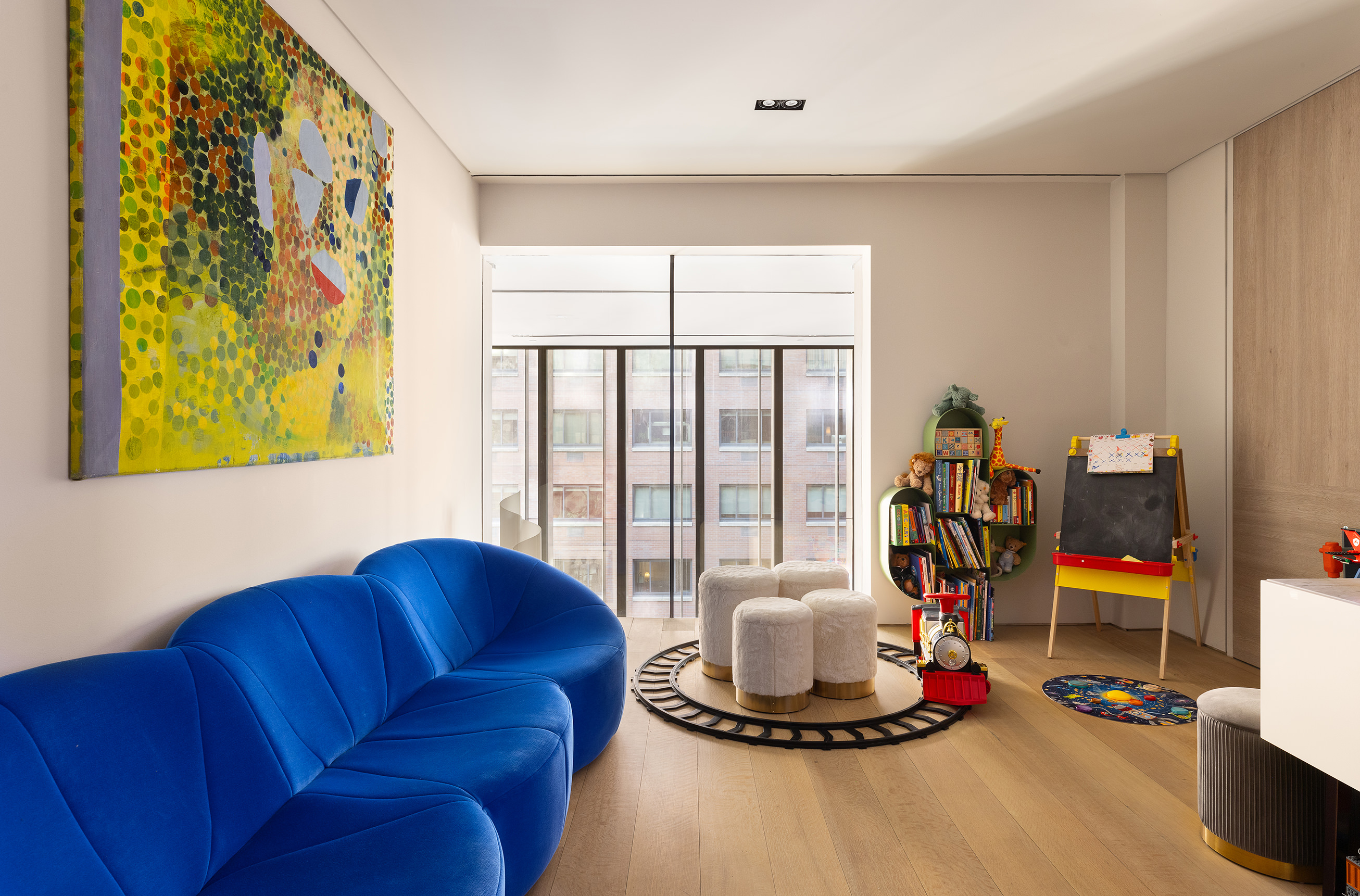 522 West 29th Street, Unit 5D Manhattan, NY 10001 - Photo 11 of 18 a living room with furniture and a flat screen tv