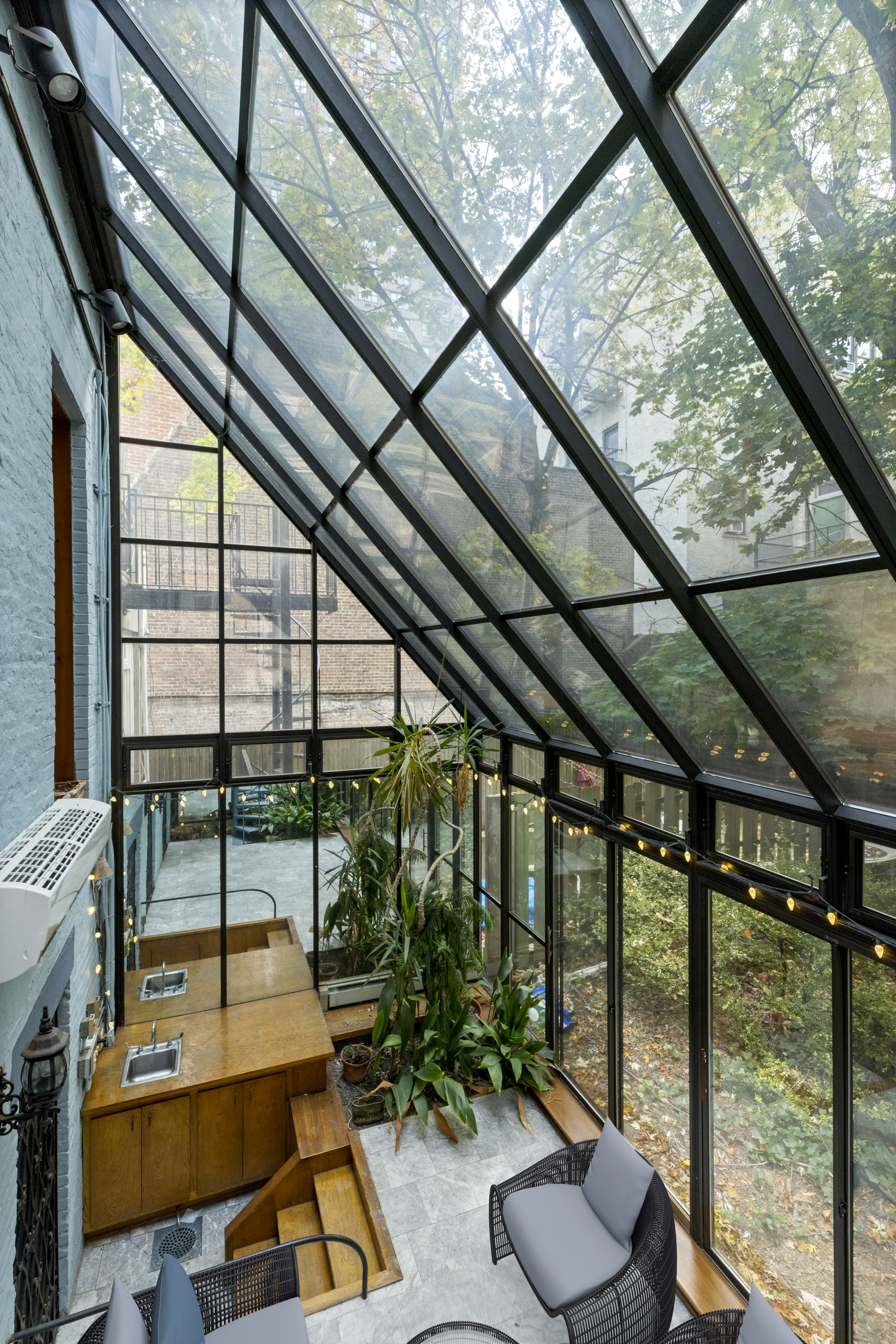 136 East 30th Street, Unit DUPLEX Manhattan, NY 10016 - Photo 12 of 26 a room with furniture and a floor to ceiling window