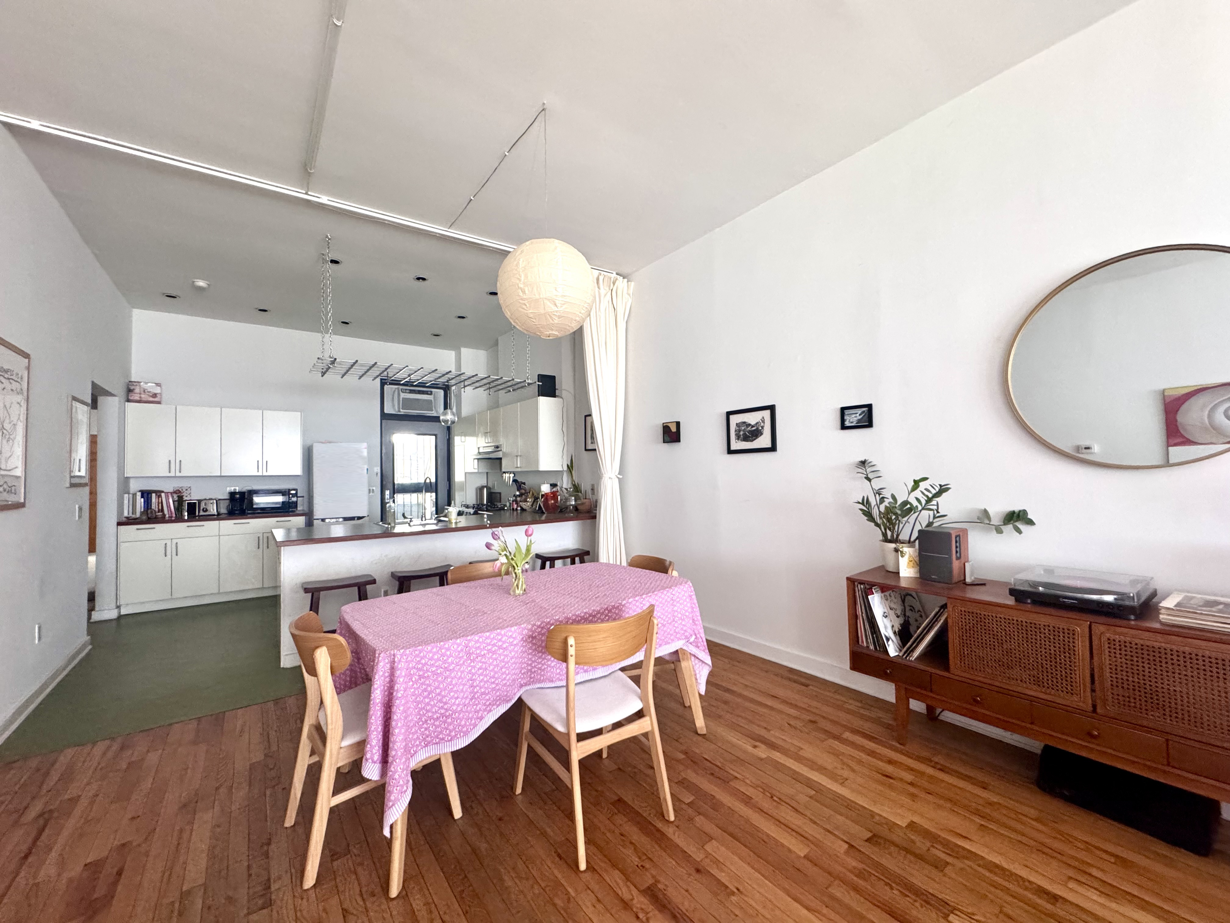 658 Classon Avenue Brooklyn, NY 11238 - Photo 3 of 15 a view of a dining room with furniture and wooden floor
