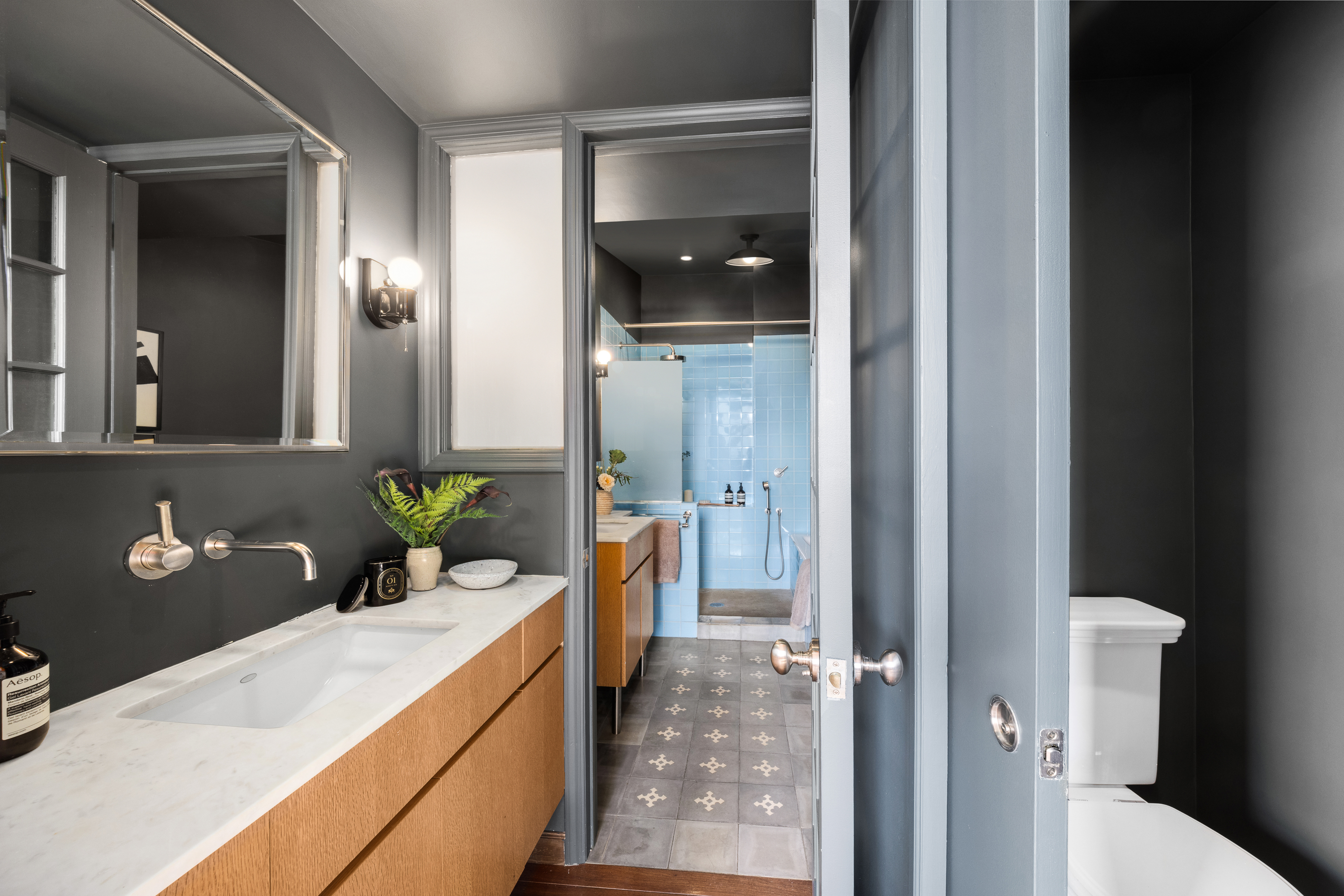 874 Broadway, Unit 501 Manhattan, NY 10003 - Photo 13 of 17 a bathroom with a granite countertop sink a toilet and shower