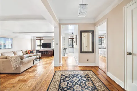 a living room with furniture and a rug