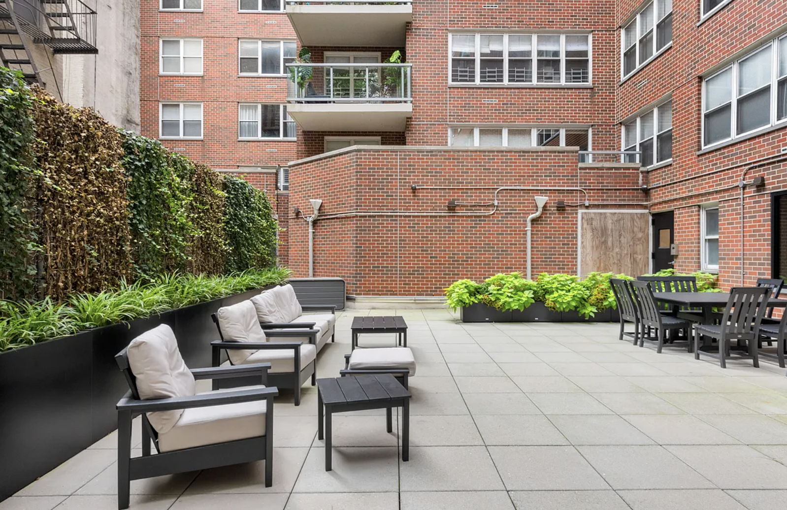 363 East 76th Street, Unit 11K Manhattan, NY 10021 - Photo 15 of 16 a view of a patio with couches and a table and chairs