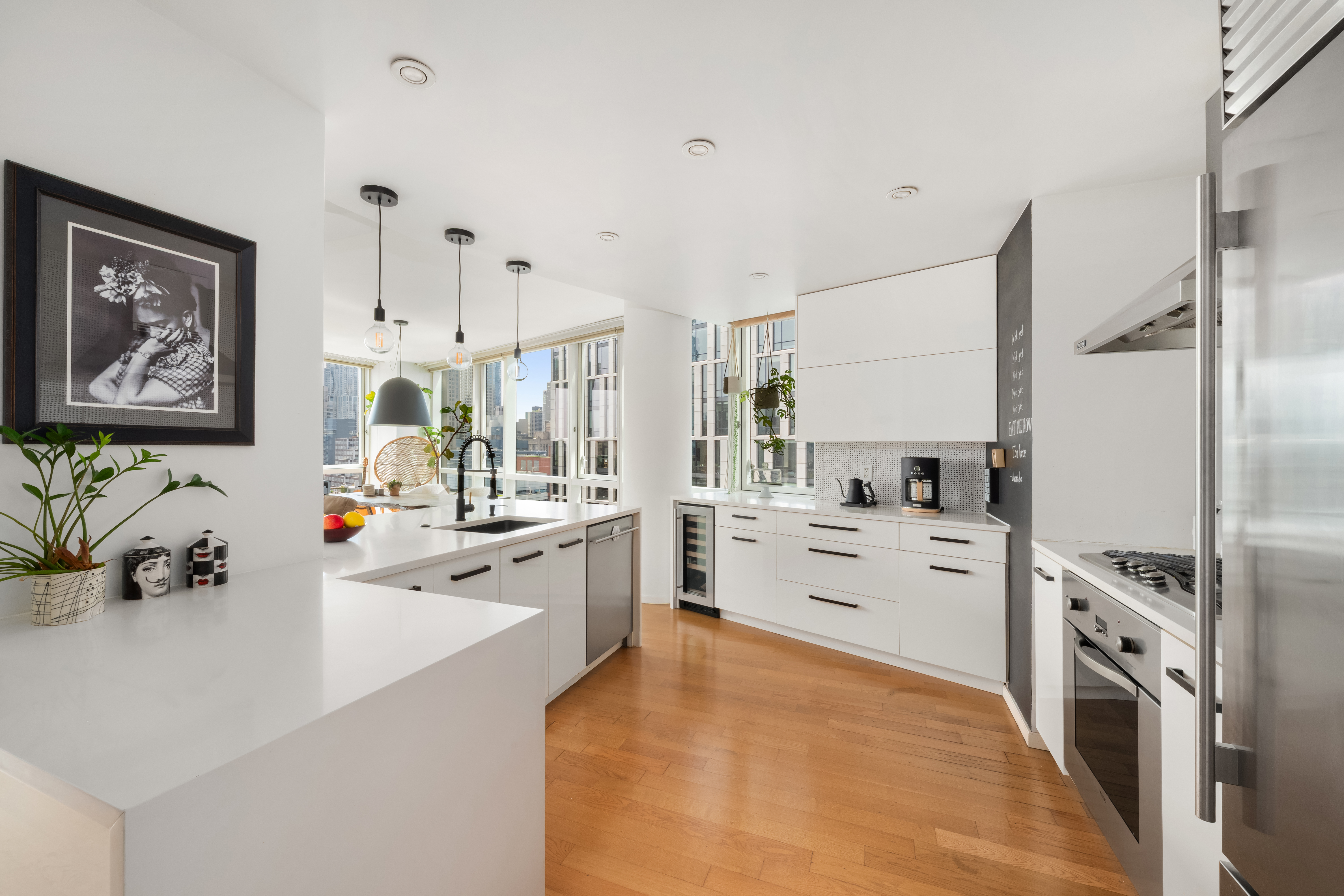 200 Chambers Street, Unit 25F Manhattan, NY 10007 - Photo 6 of 14 a large white kitchen with cabinets