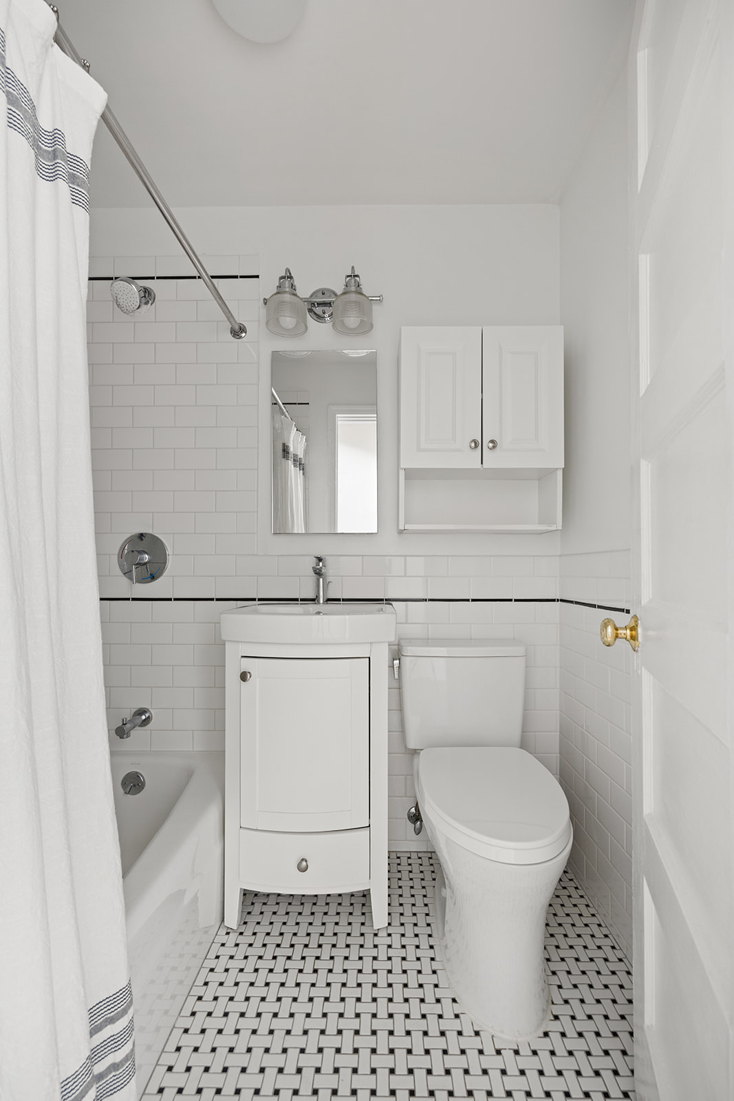273 Windsor Place Brooklyn, NY 11218 - Photo 9 of 29 a bathroom with a toilet a sink and a shower