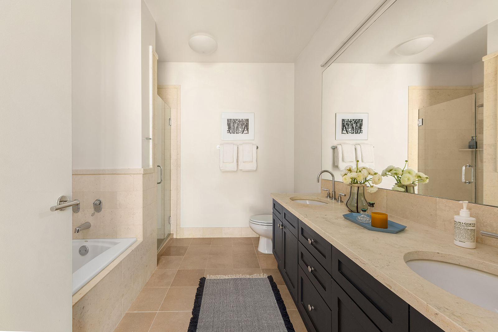 252 7th Avenue, Unit 14G Manhattan, NY 10001 - Photo 10 of 20 a bath room with a sink and a large mirror