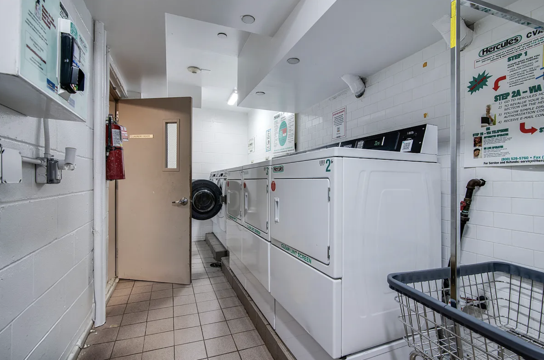 41-26 27th Street, Unit 4B Queens, NY 11101 - Photo 8 of 10 a white refrigerator freezer sitting inside of a kitchen