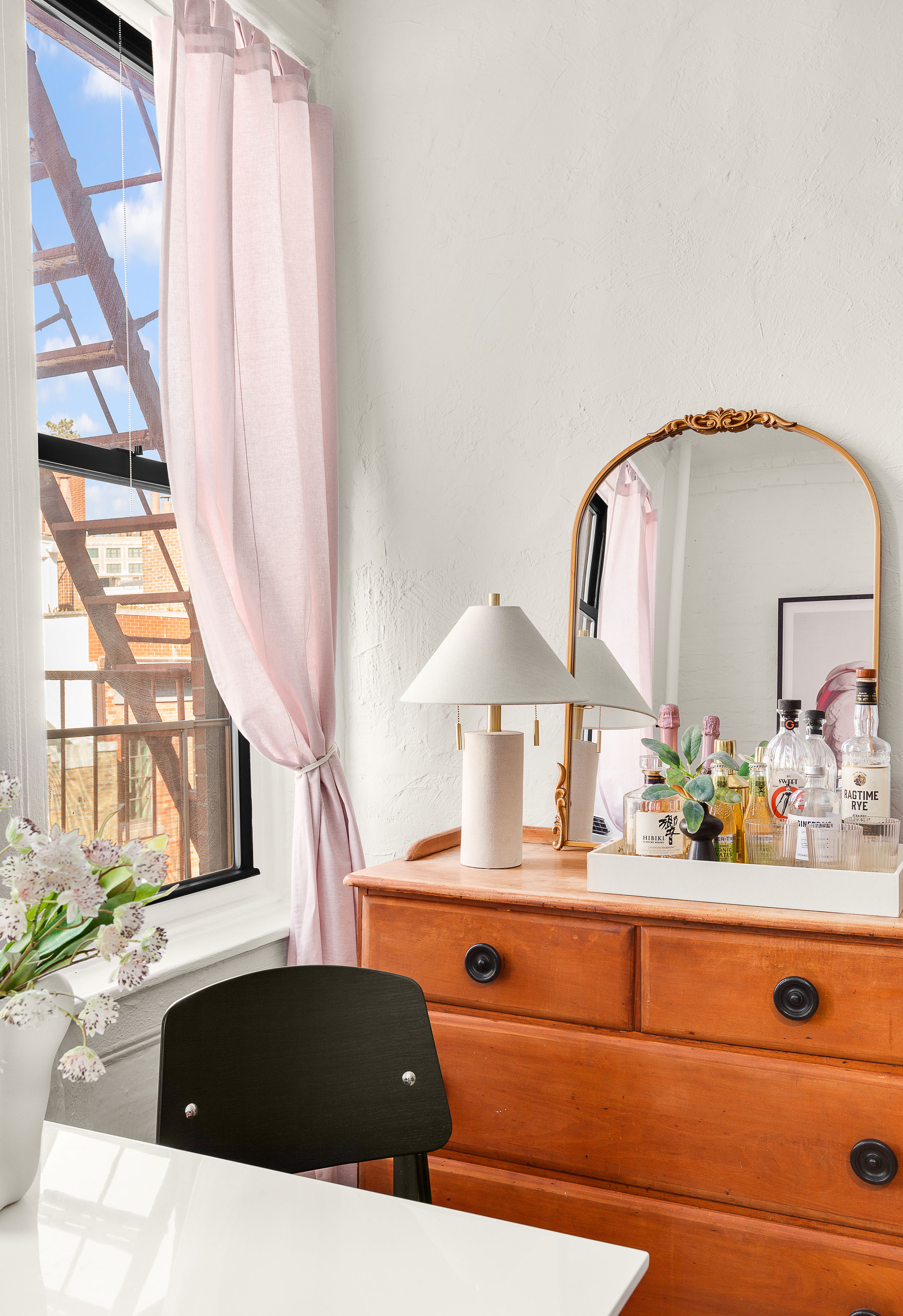 24 Cornelia Street, Unit 15 Manhattan, NY 10014 - Photo 4 of 13 a bathroom with a sink and a large mirror next to a window