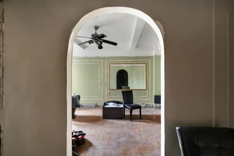 a living room with furniture and white walls