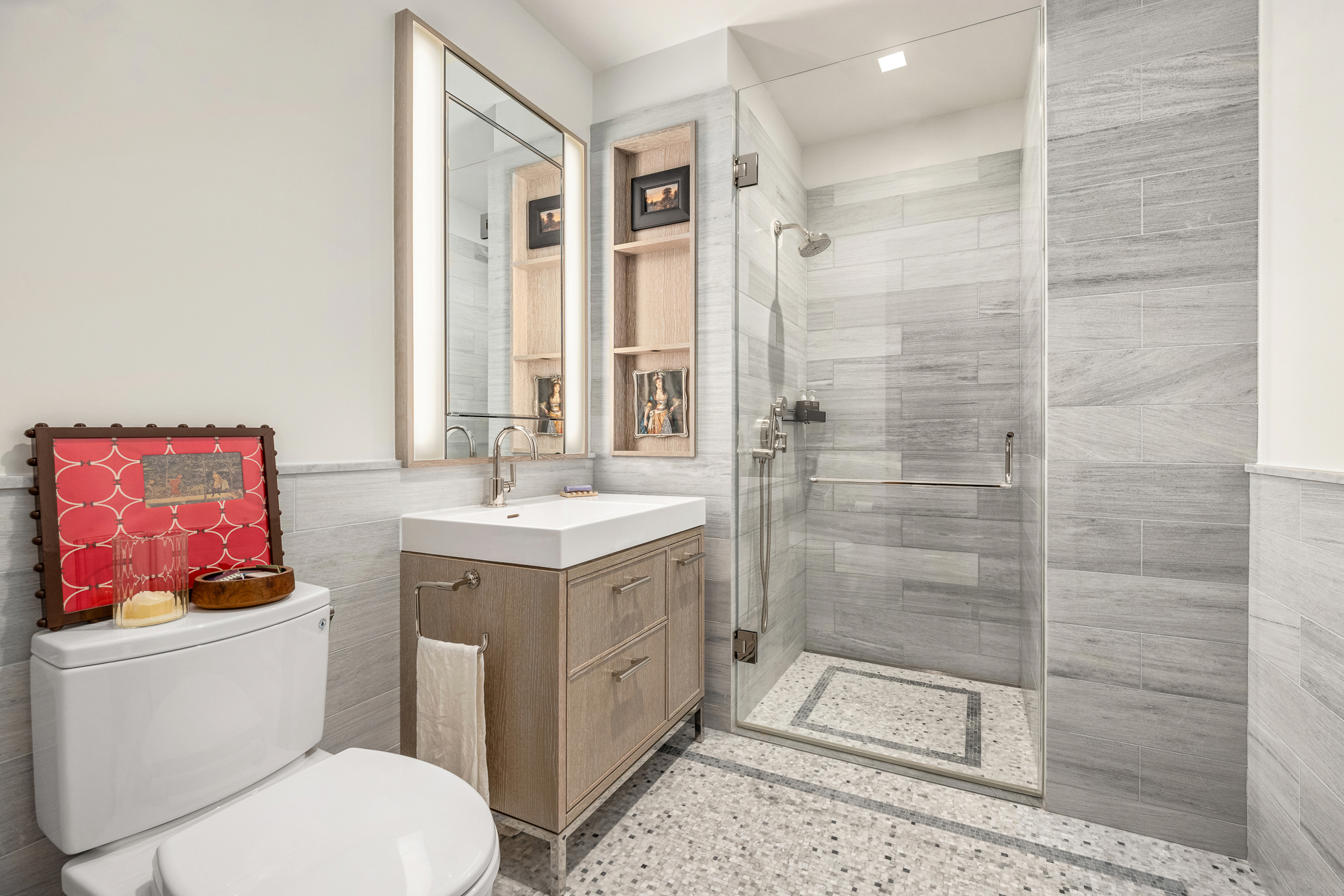 25 Park Row, Unit 29A Manhattan, NY 10038 - Photo 17 of 23 a bathroom with a sink toilet and shower