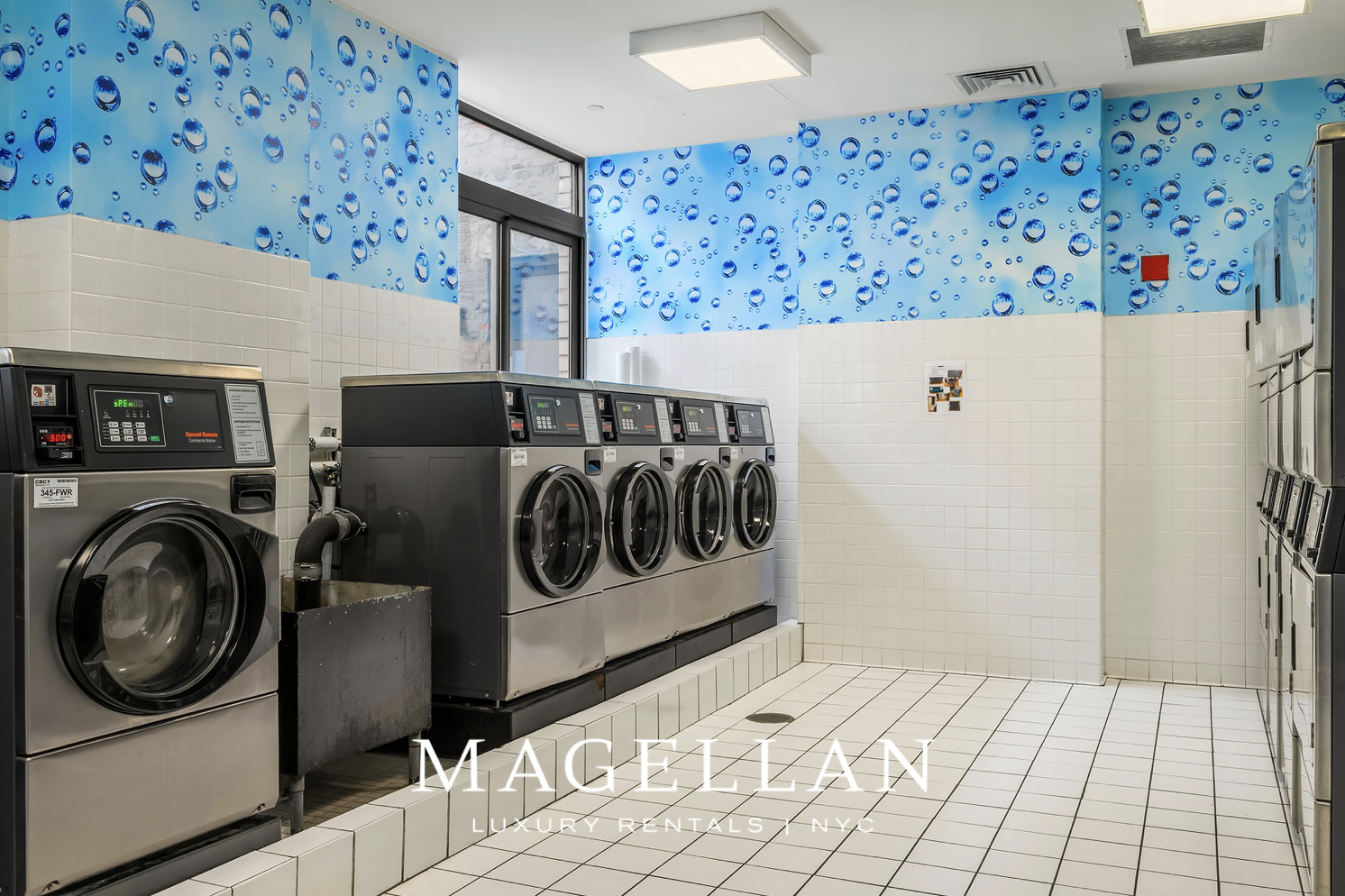 35 West 33rd Street, Unit 4B Manhattan, NY 10001 - Photo 12 of 17 a utility room with dryer and washer