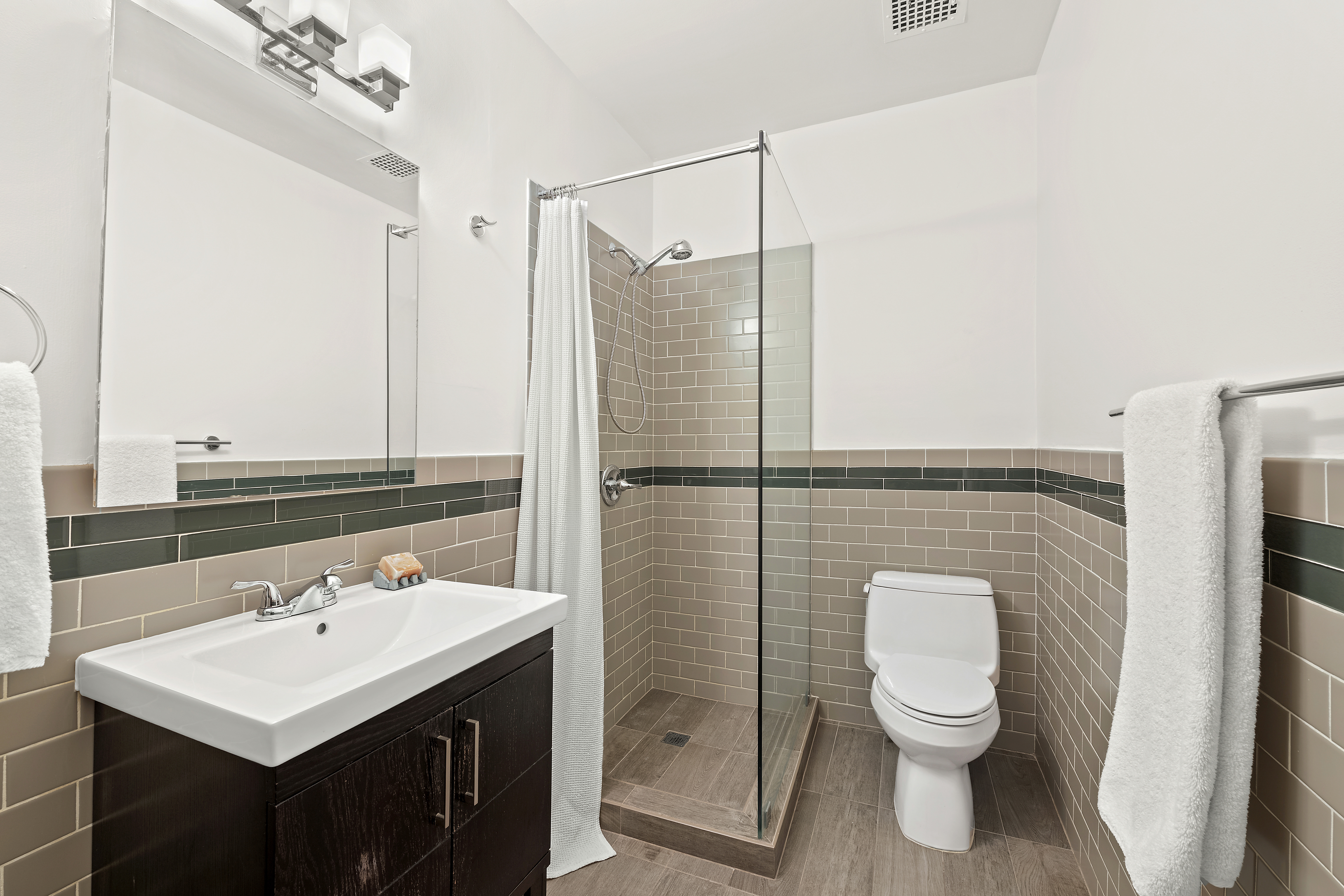 120 West 18th Street, Unit 2A Manhattan, NY 10011 - Photo 8 of 14 a bathroom with a sink toilet and shower
