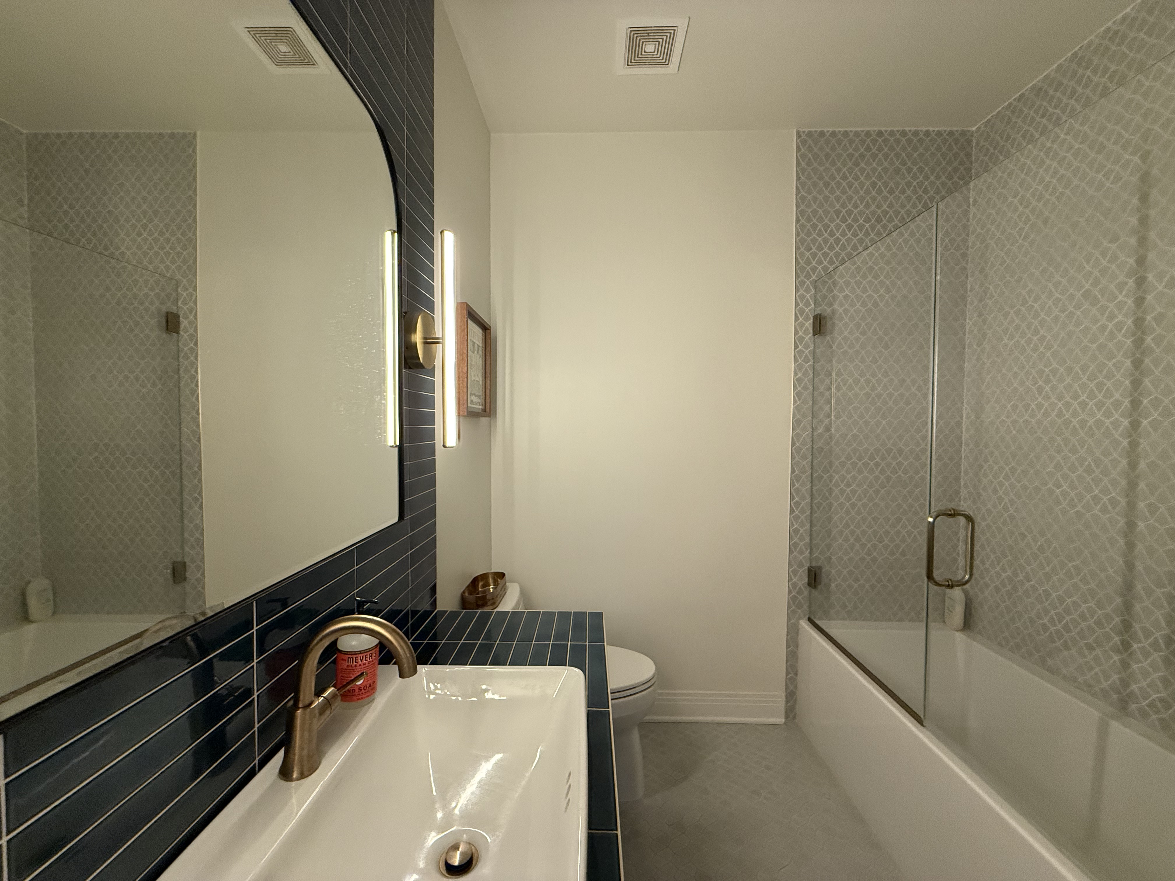5108 Eilers Avenue Austin, TX 78751 - Photo 12 of 13 a bathroom with a tub and sink