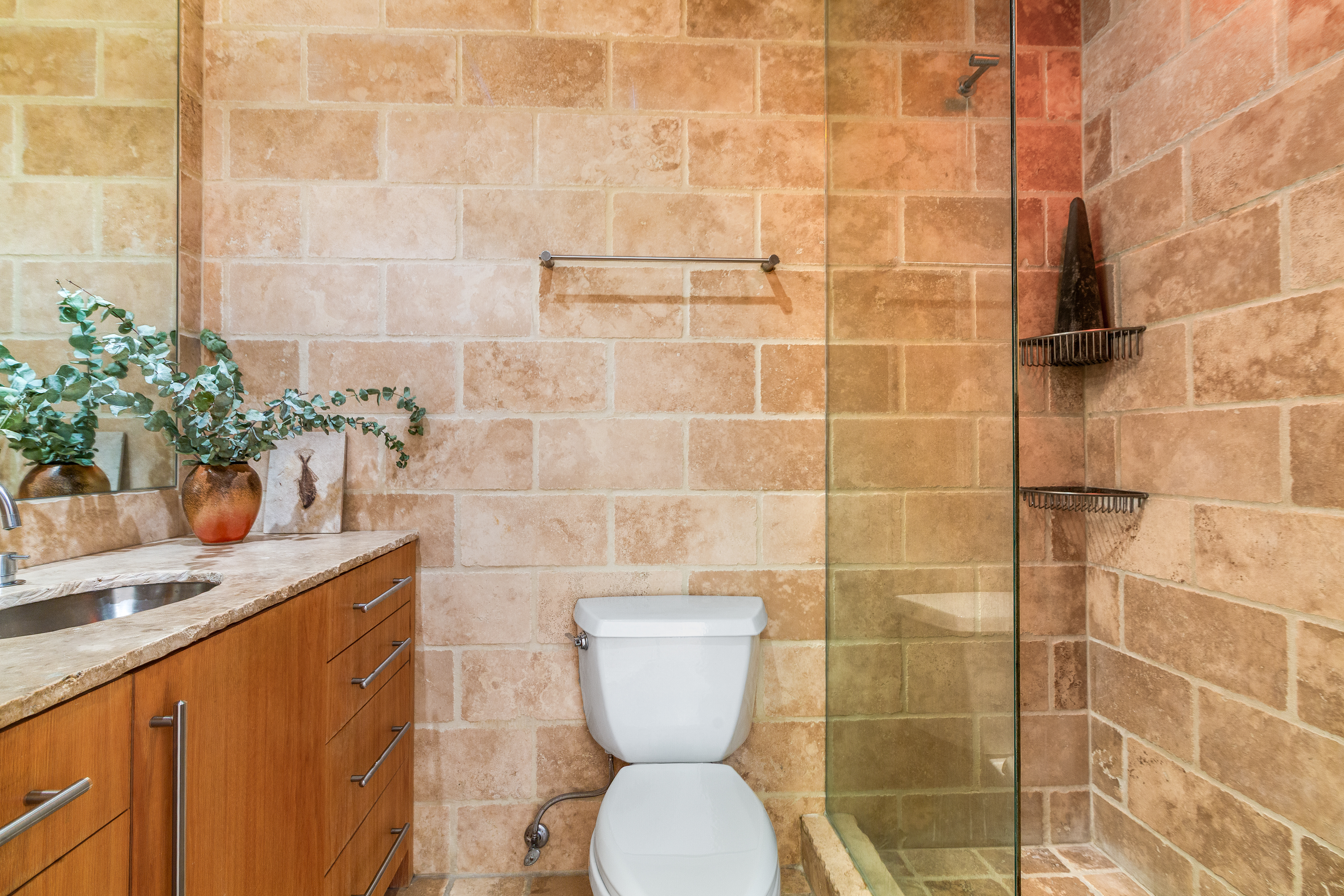 529 West 42nd Street, Unit 7A Manhattan, NY 10036 - Photo 15 of 18 a bathroom with a toilet a sink and mirror