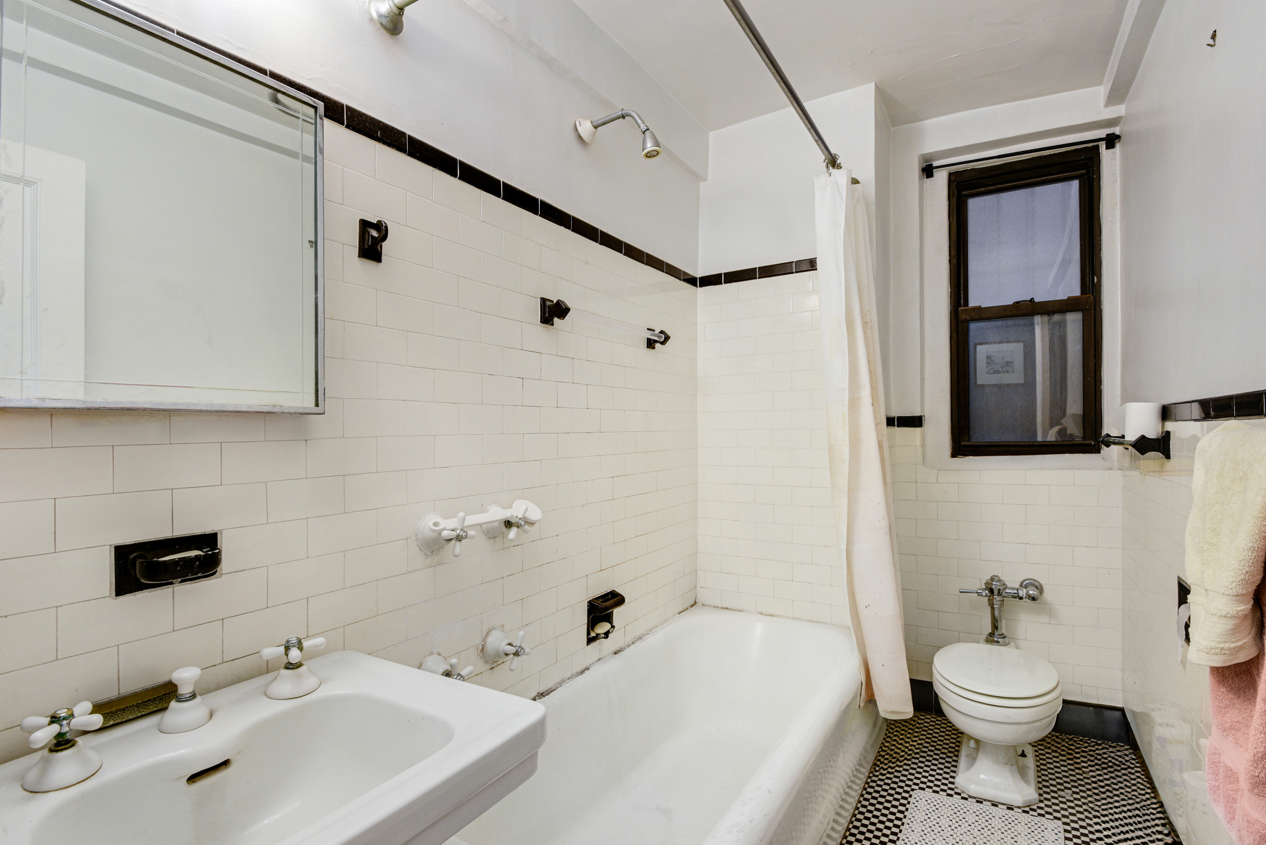 205 East 78th Street, Unit 2T Manhattan, NY 10075 - Photo 8 of 10 a bathroom with a sink toilet and shower