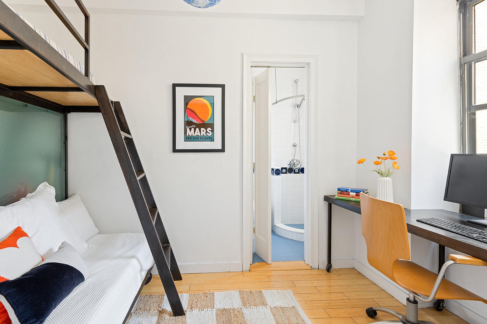 135 Eastern Parkway, Unit 14E Brooklyn, NY 11238 - Photo 10 of 16 a bedroom with a bed and furniture