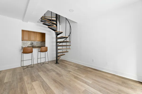 a view of an empty room with stairs