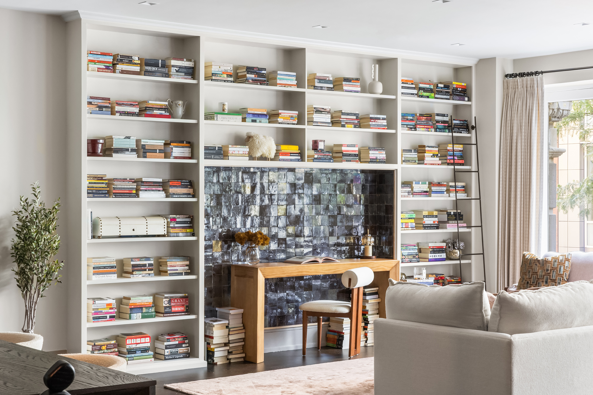 14-16 Wooster Street, Unit 2 Manhattan, NY 10013 - Photo 5 of 22 a living room with furniture cabinets and a book shelf