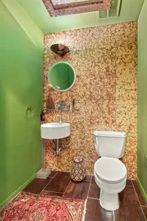 a bathroom with a toilet and a sink