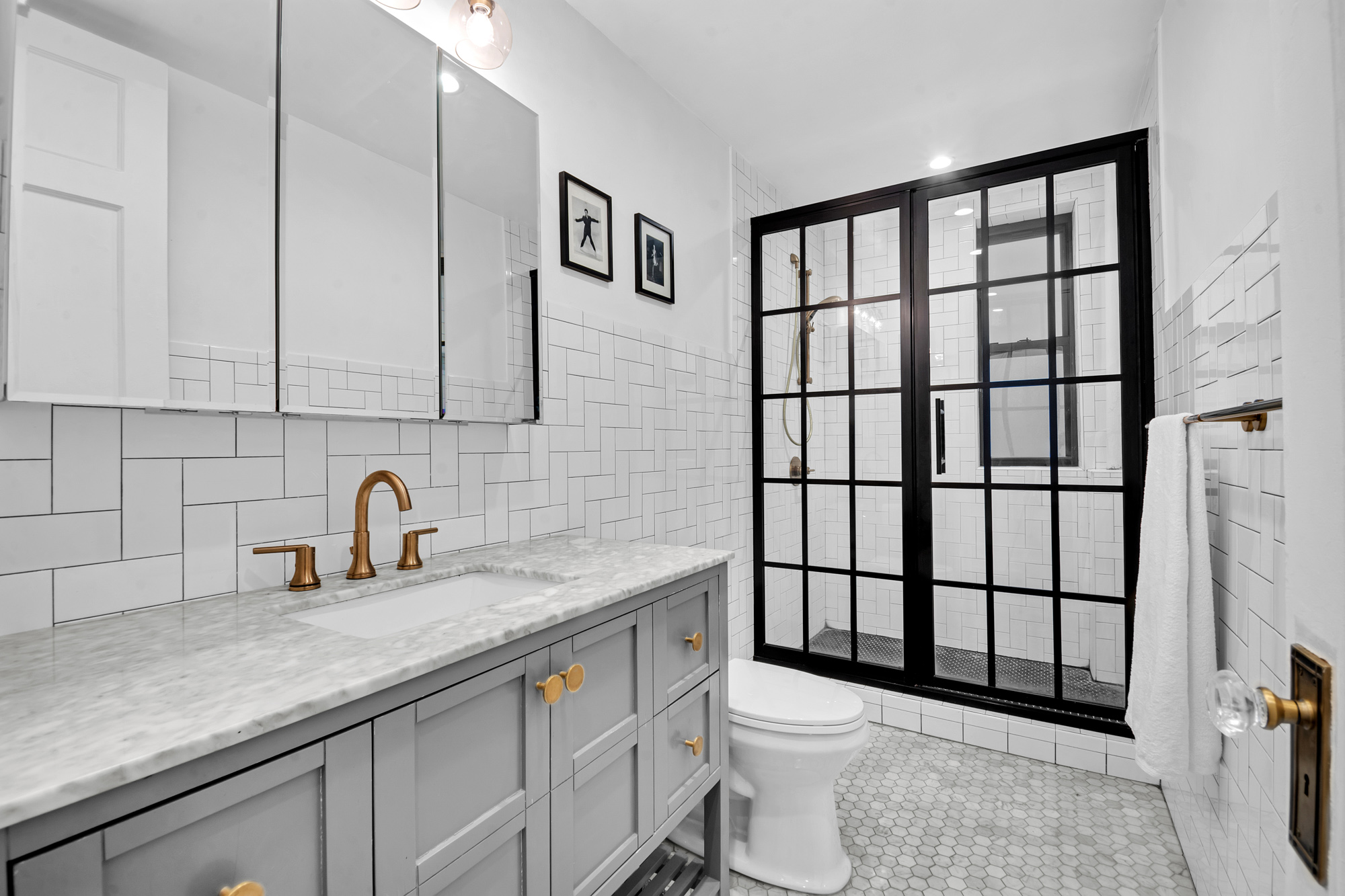 47 Fort Washington Avenue, Unit 55 Manhattan, NY 10032 - Photo 13 of 20 a bathroom with a granite countertop sink toilet and shower