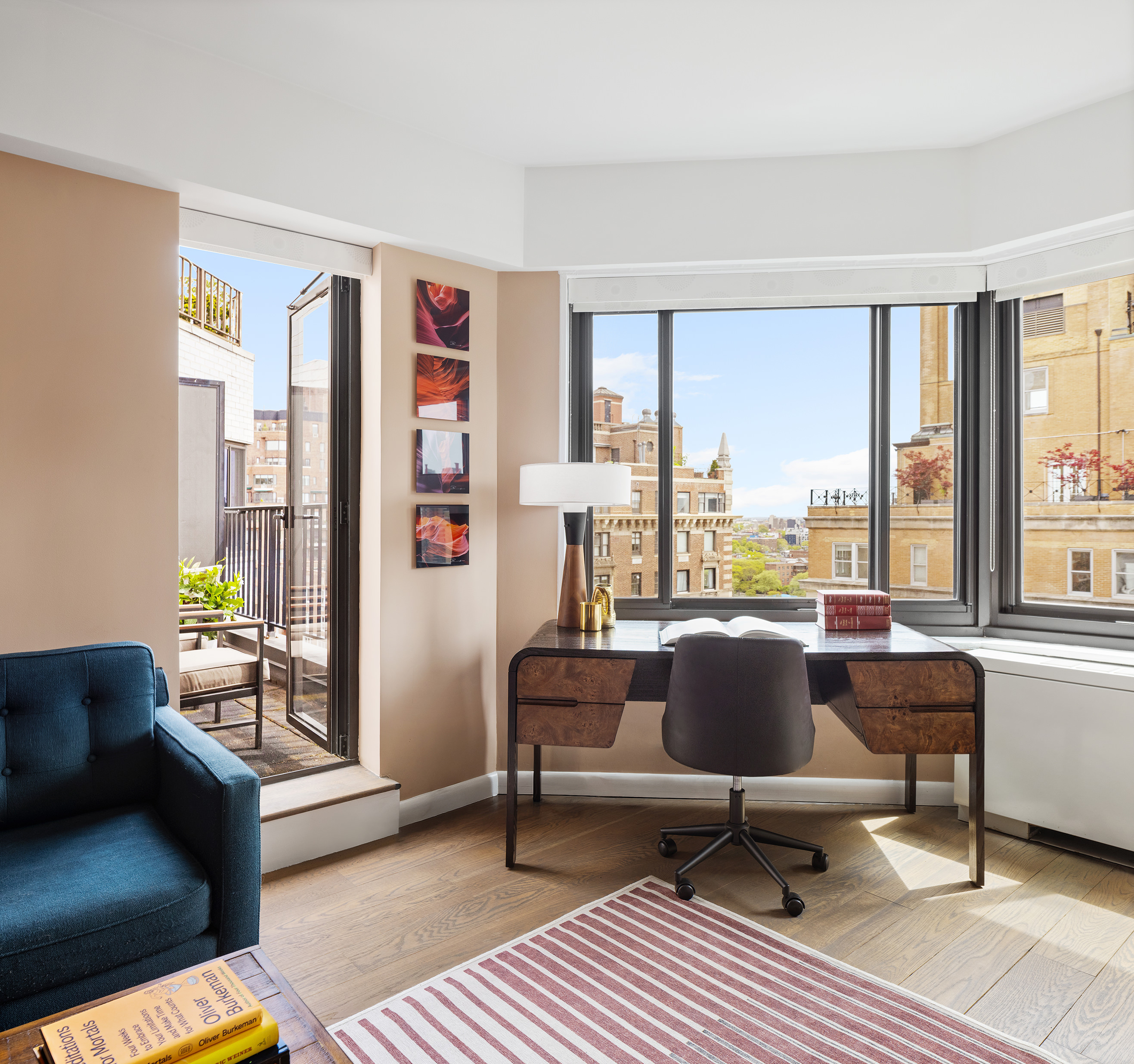 10 East End Avenue, Unit 18D Manhattan, NY 10075 - Photo 12 of 21 a living room with furniture and a window