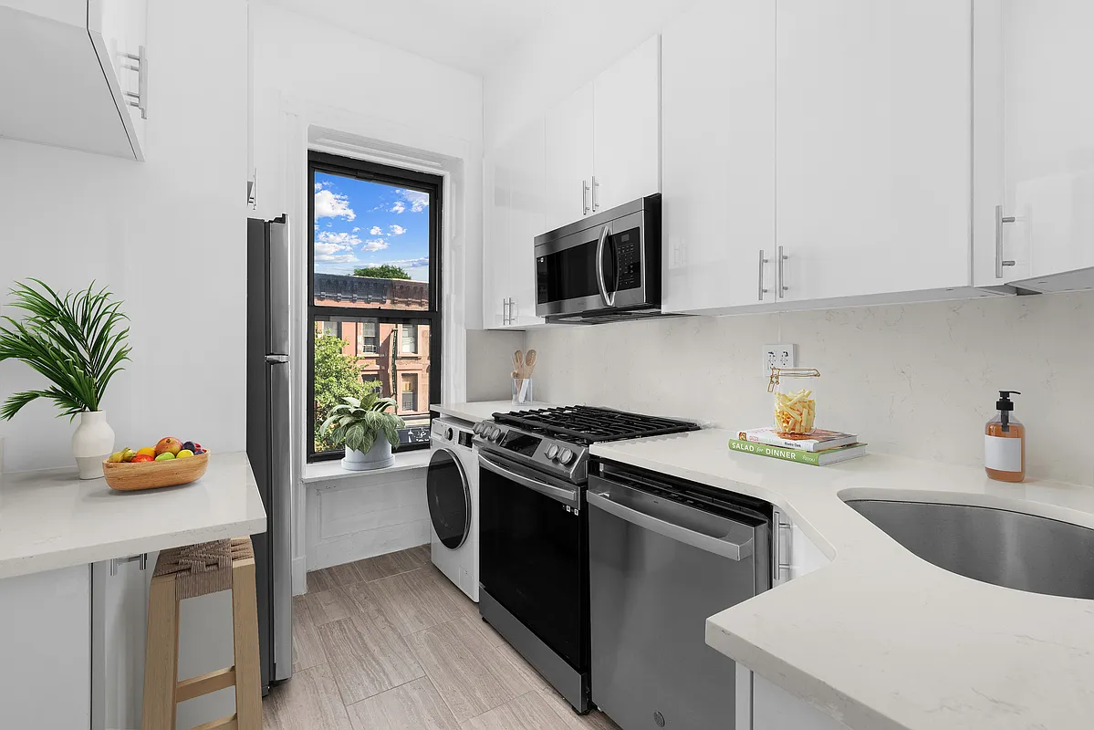 532 10th Street, Unit 1 Brooklyn, NY 11215 - Photo 2 of 6 a kitchen that has a sink and a stove