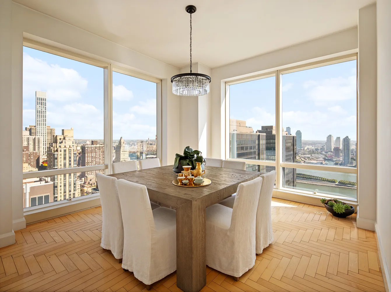 a dining room with furniture water view and wooden floor