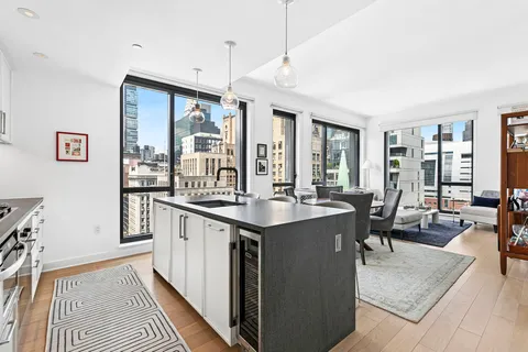 a open kitchen with stainless steel appliances granite countertop a stove and cabinets