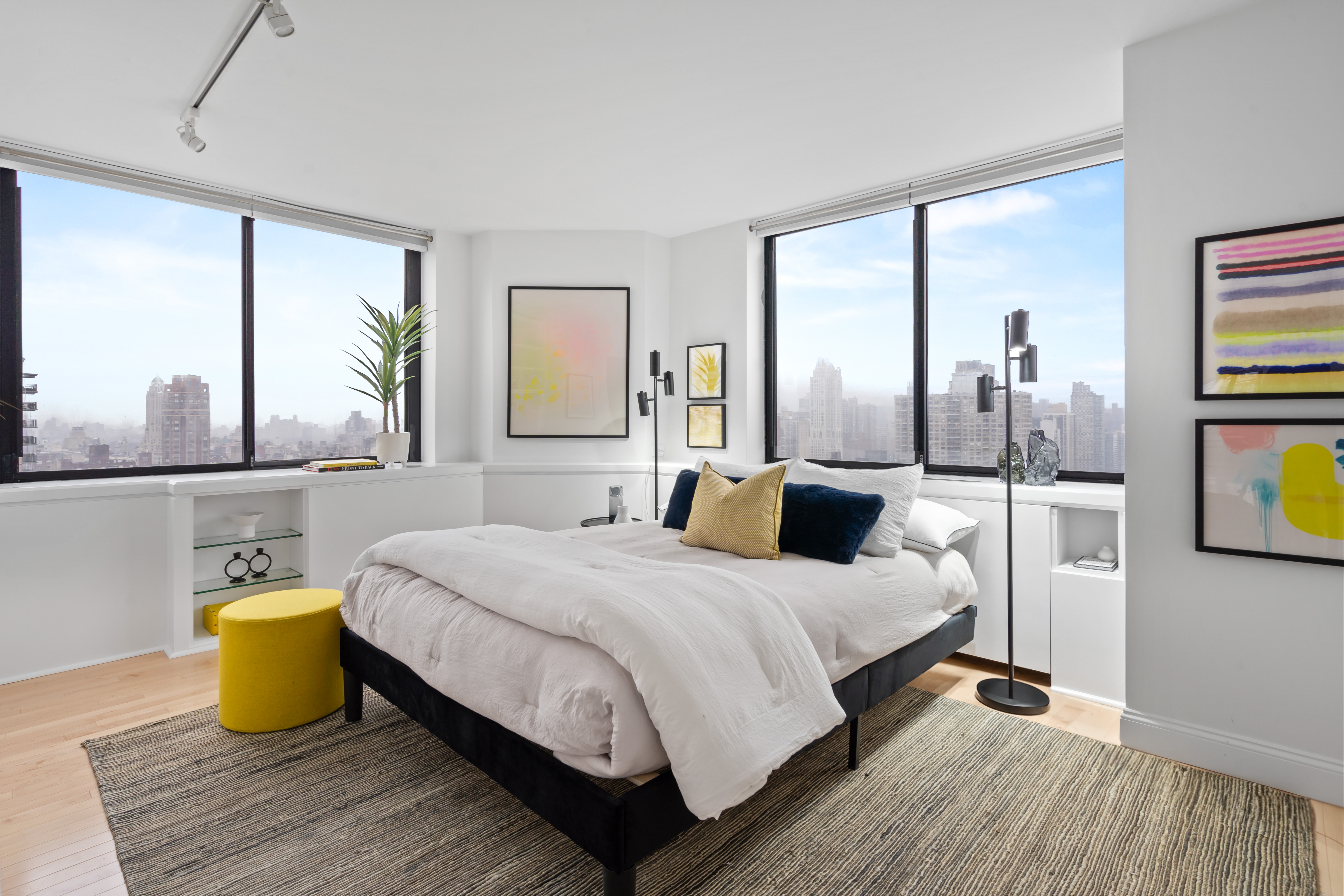 330 East 75th Street, Unit 32A Manhattan, NY 10021 - Photo 10 of 17 a bedroom with a bed and wooden floor