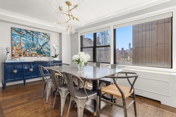 a view of a dining room with furniture window and wooden floor