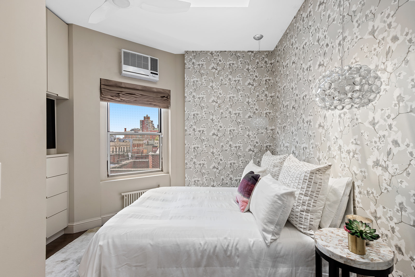 77 Perry Street, Unit 6CD Manhattan, NY 10014 - Photo 10 of 16 a bedroom with a bed and a window