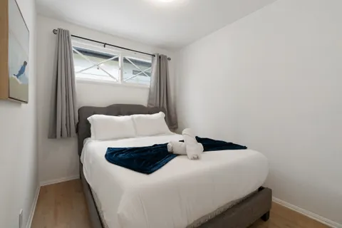 a bedroom with a bed and window