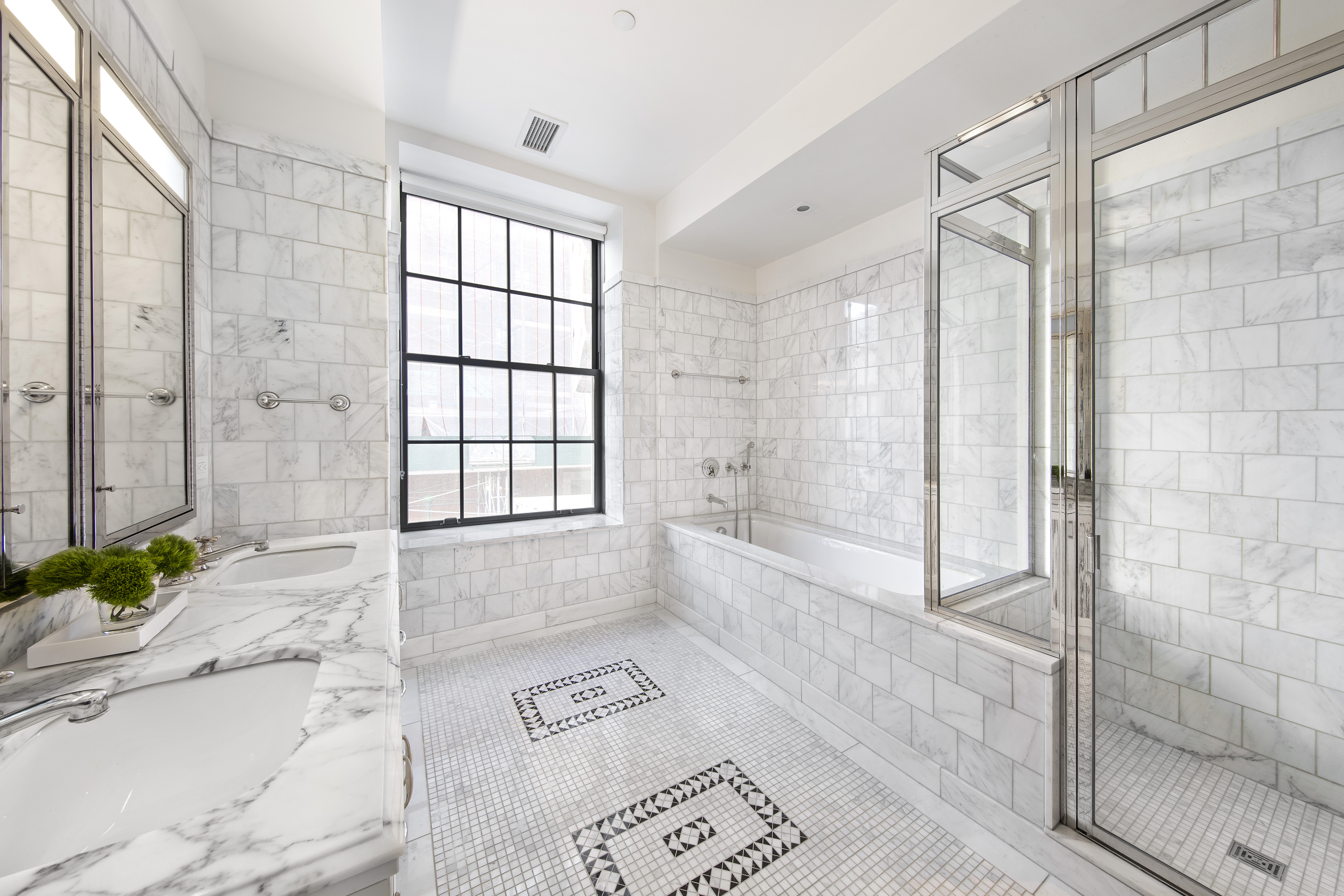 160 West 12th Street, Unit 28 Manhattan, NY 10011 - Photo 5 of 9 a bathroom with a granite countertop tub shower and sink