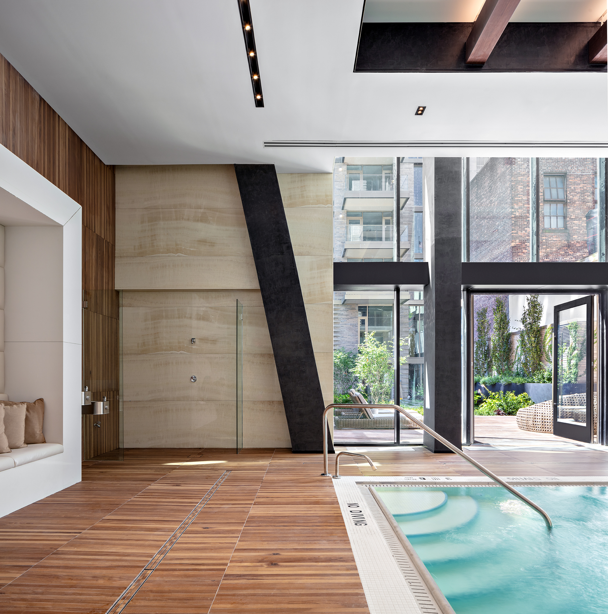 505-513 West 43rd Street, Unit 6K Manhattan, NY 10036 - Photo 10 of 16 a view of a room with wooden floor and windows