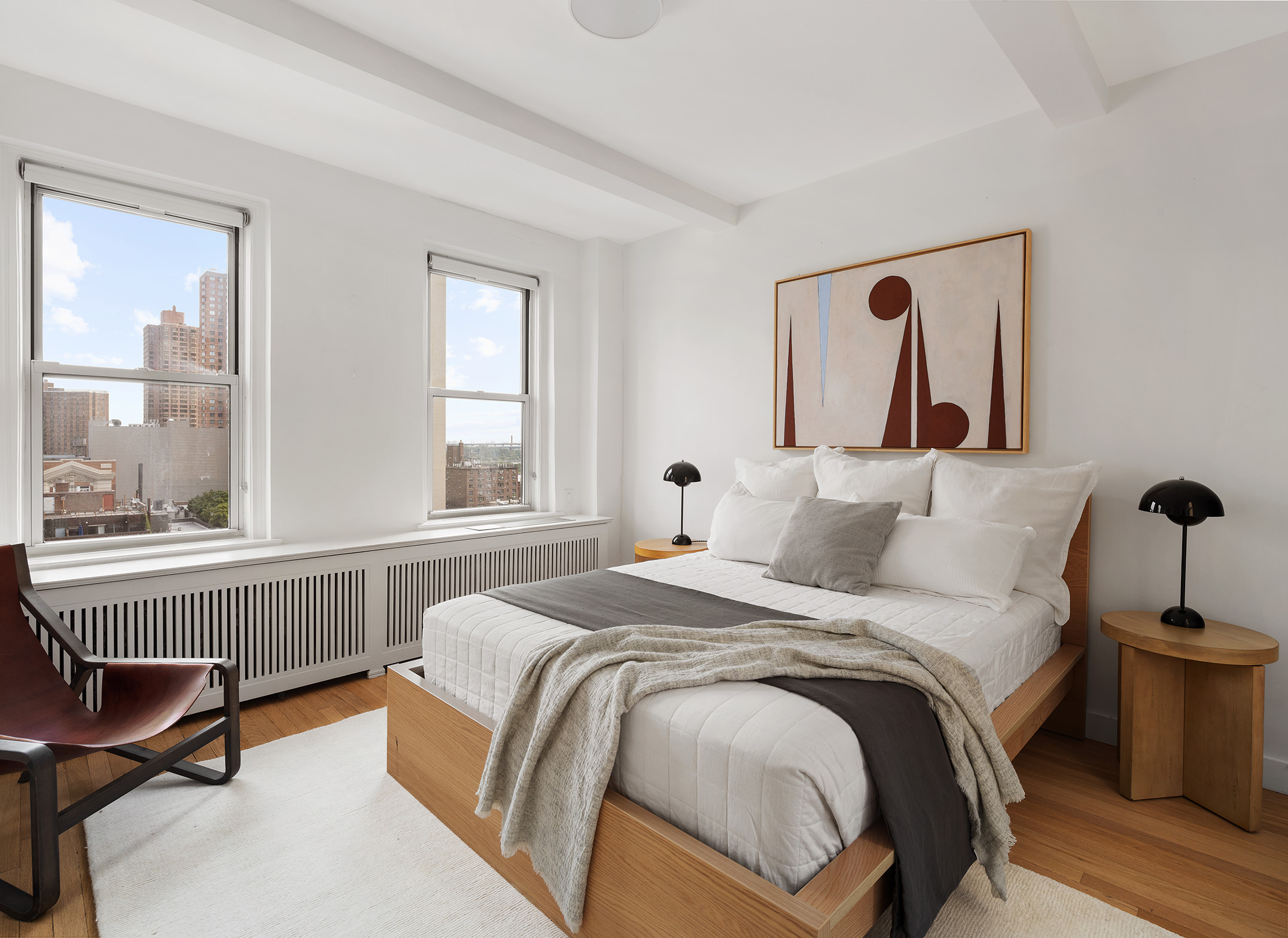 425 East 86th Street, Unit 11E Manhattan, NY 10028 - Photo 10 of 19 a bedroom with a bed and a large window